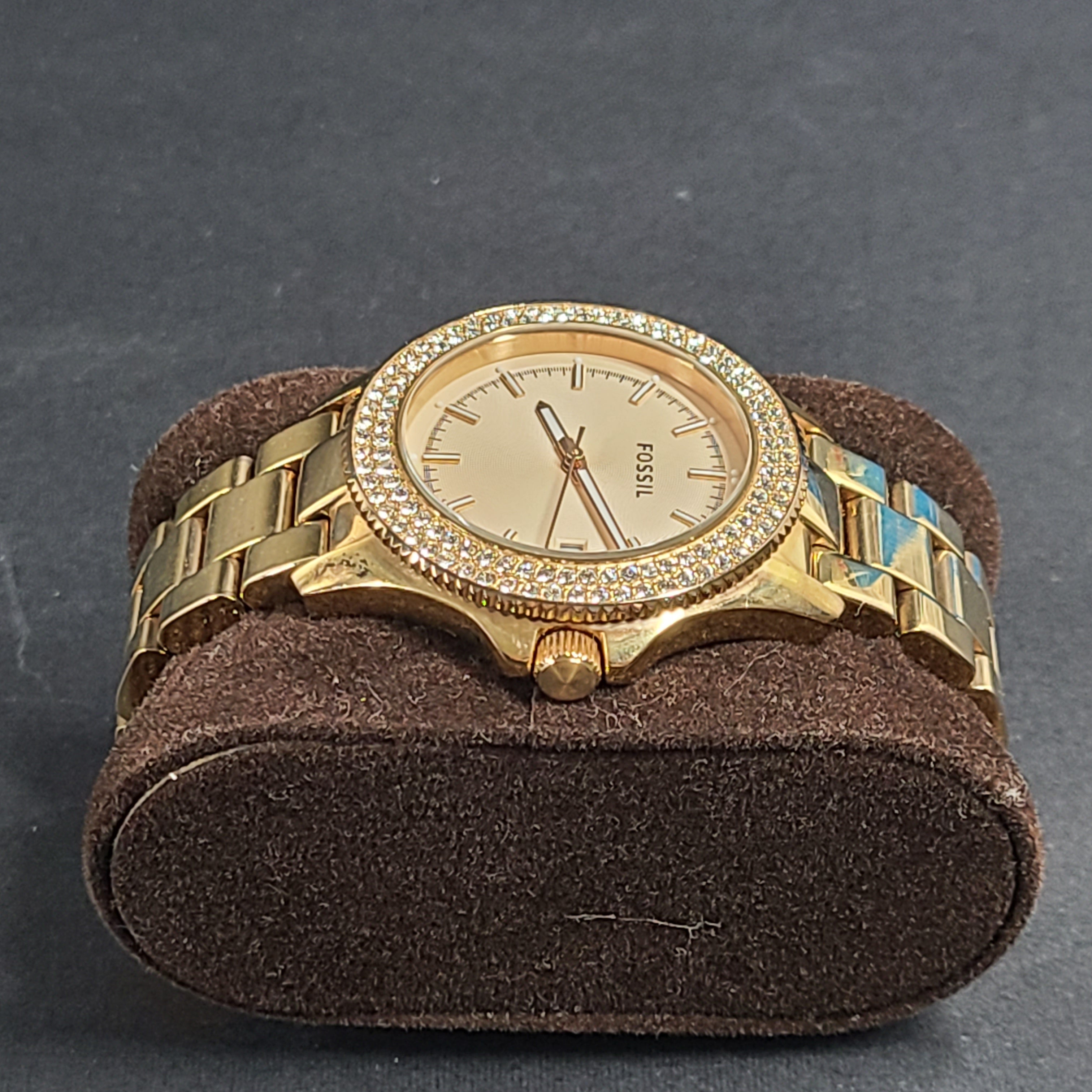 A stylish Fossil Analog Women's Watch with gold tones and crystal accents