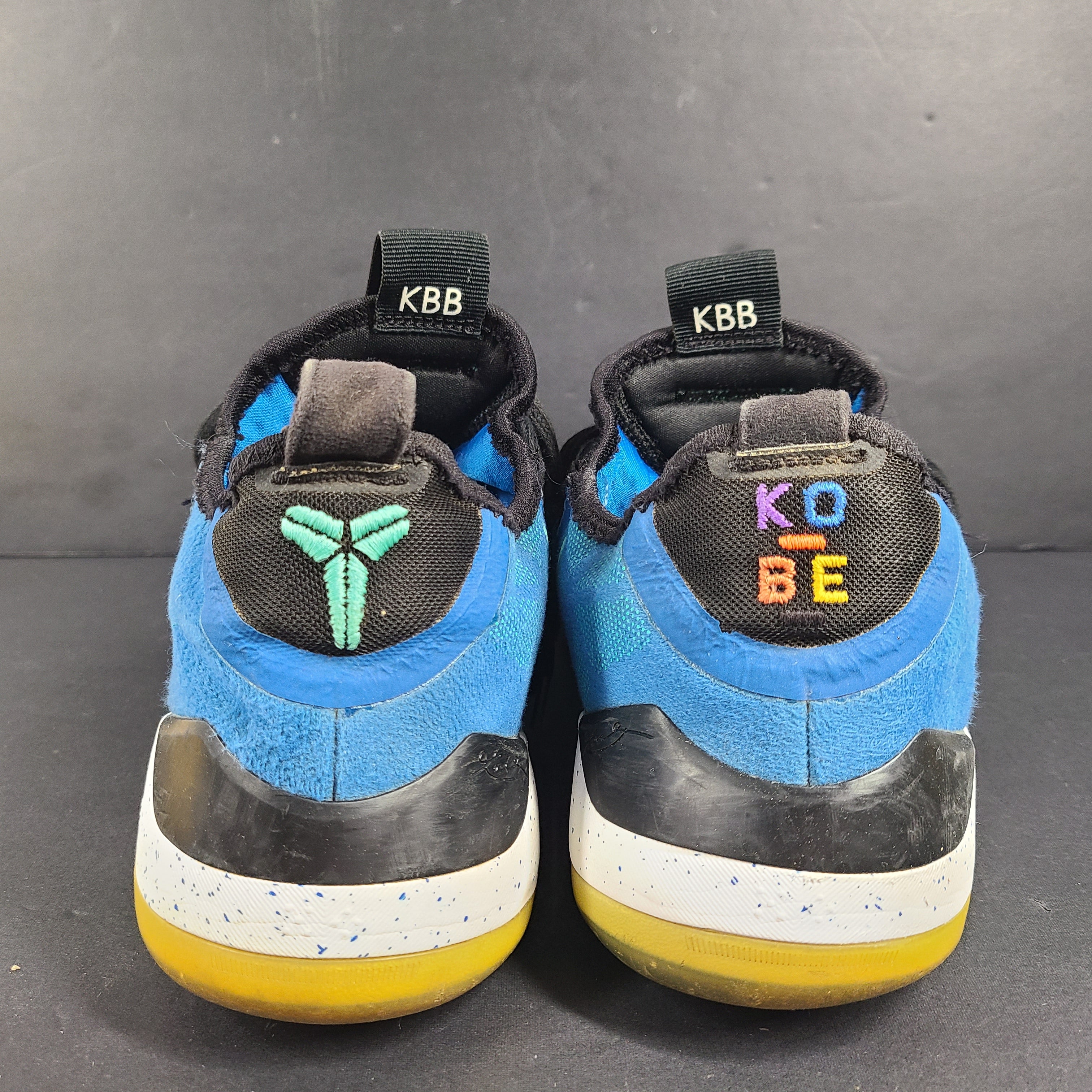 A pair of Nike Kobe AD NXT 360 Basketball Shoes in blue and yellow
