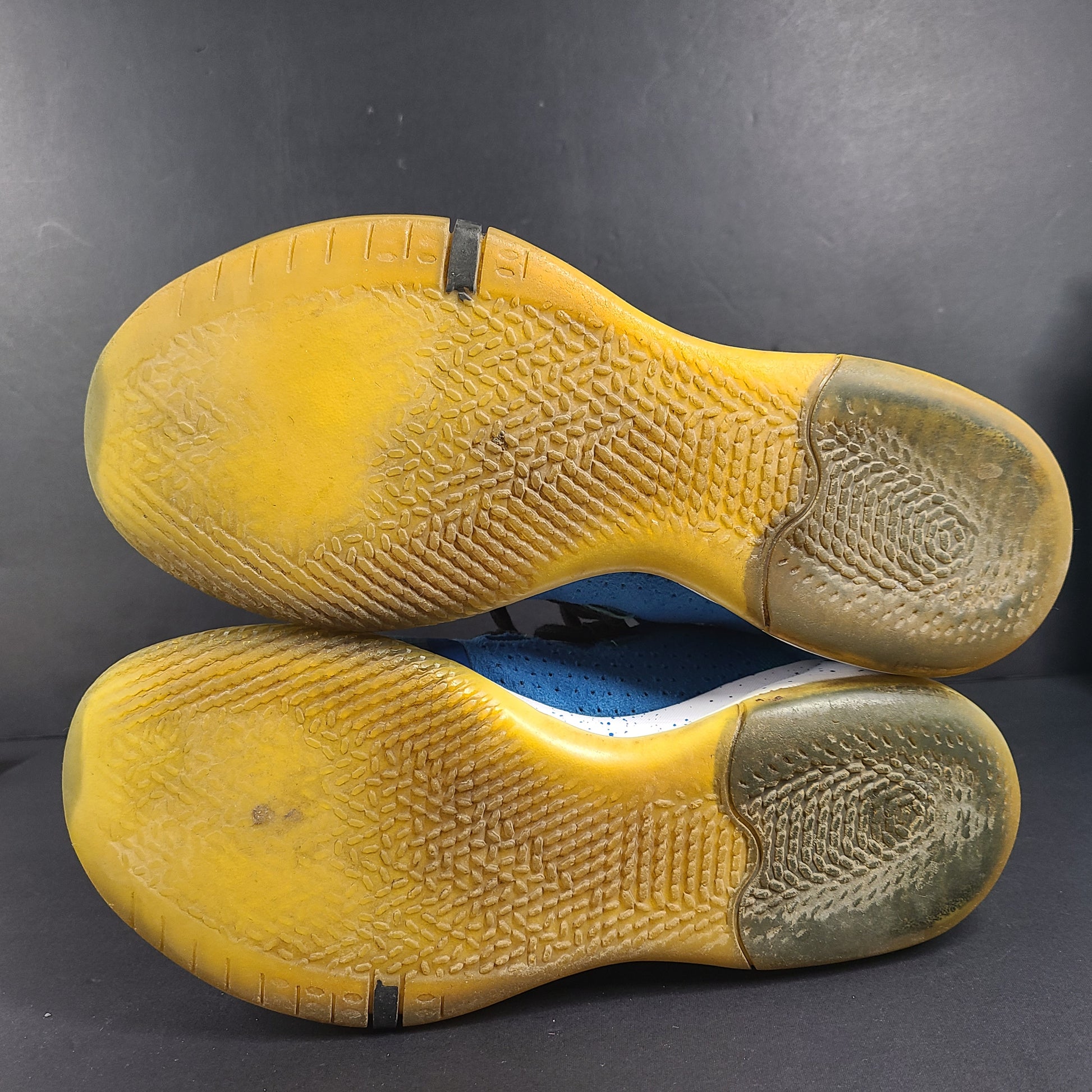 A pair of Nike Kobe AD NXT 360 Basketball Shoes in blue and yellow