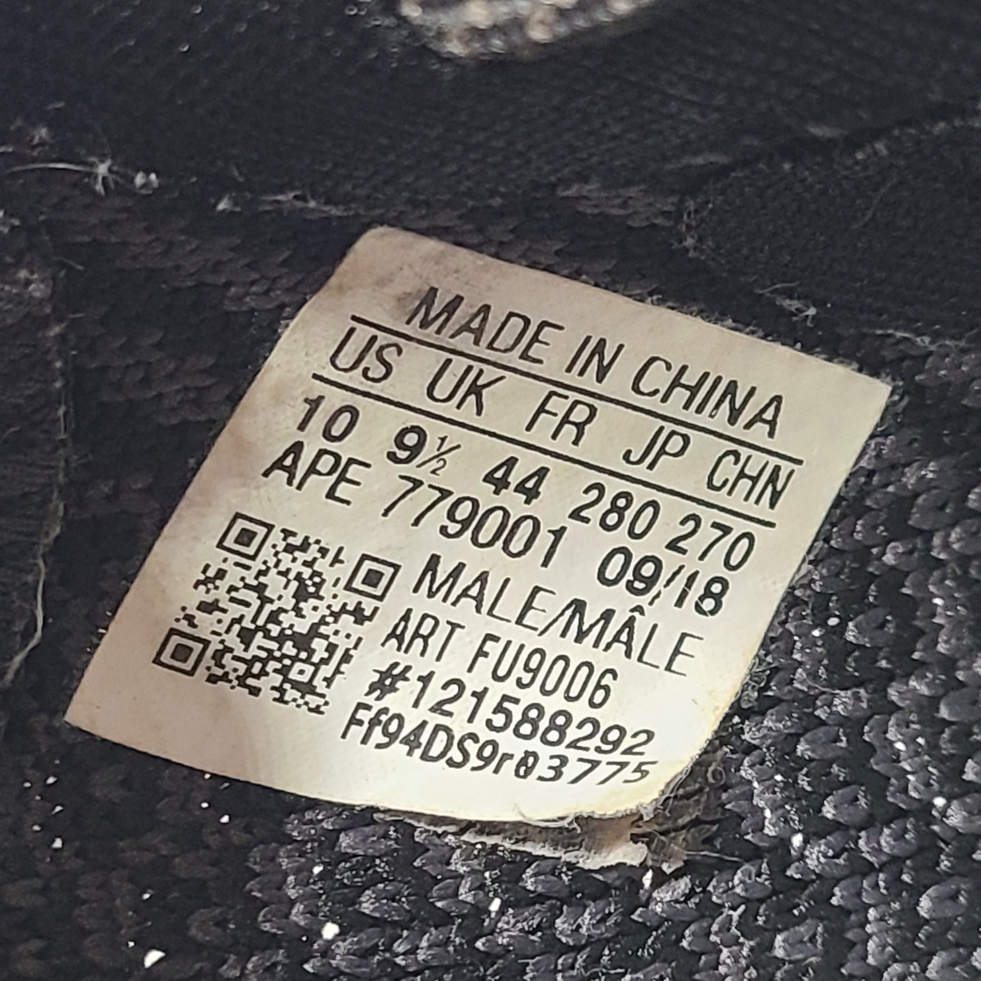 A pair of black and gray Adidas Yeezy Boost 350 V2 sneakers in size 10.5