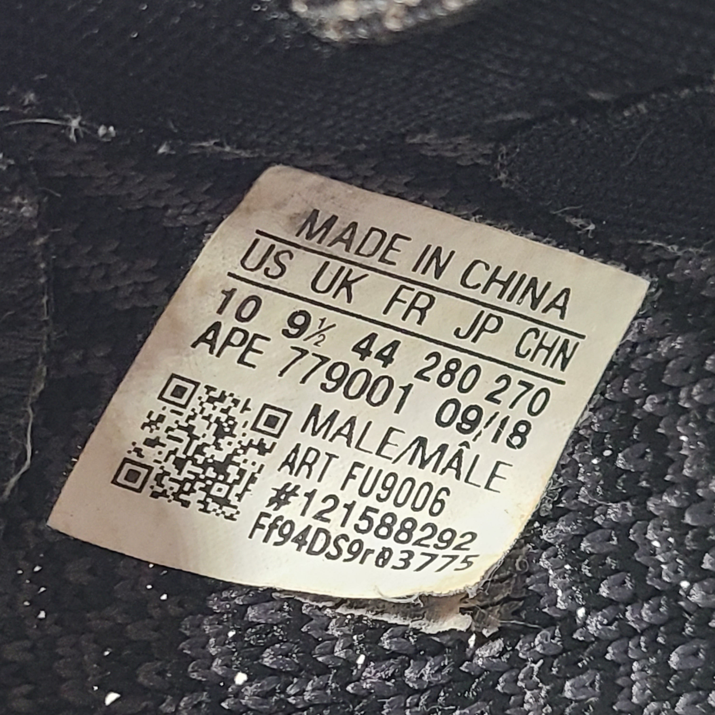 A pair of black and gray Adidas Yeezy Boost 350 V2 sneakers in size 10.5
