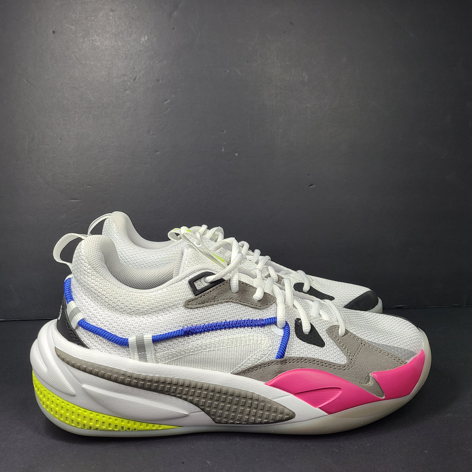 A pair of white, gray, blue, and pink PUMA RS-Dreamer sneakers for men