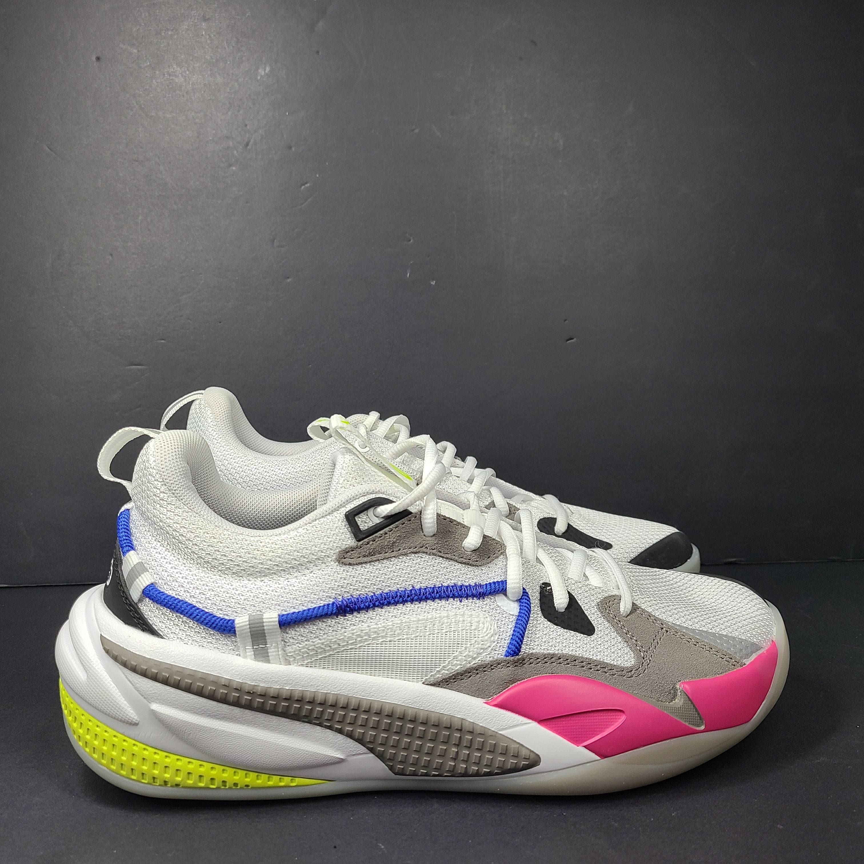 A pair of white, gray, blue, and pink PUMA RS-Dreamer sneakers for men