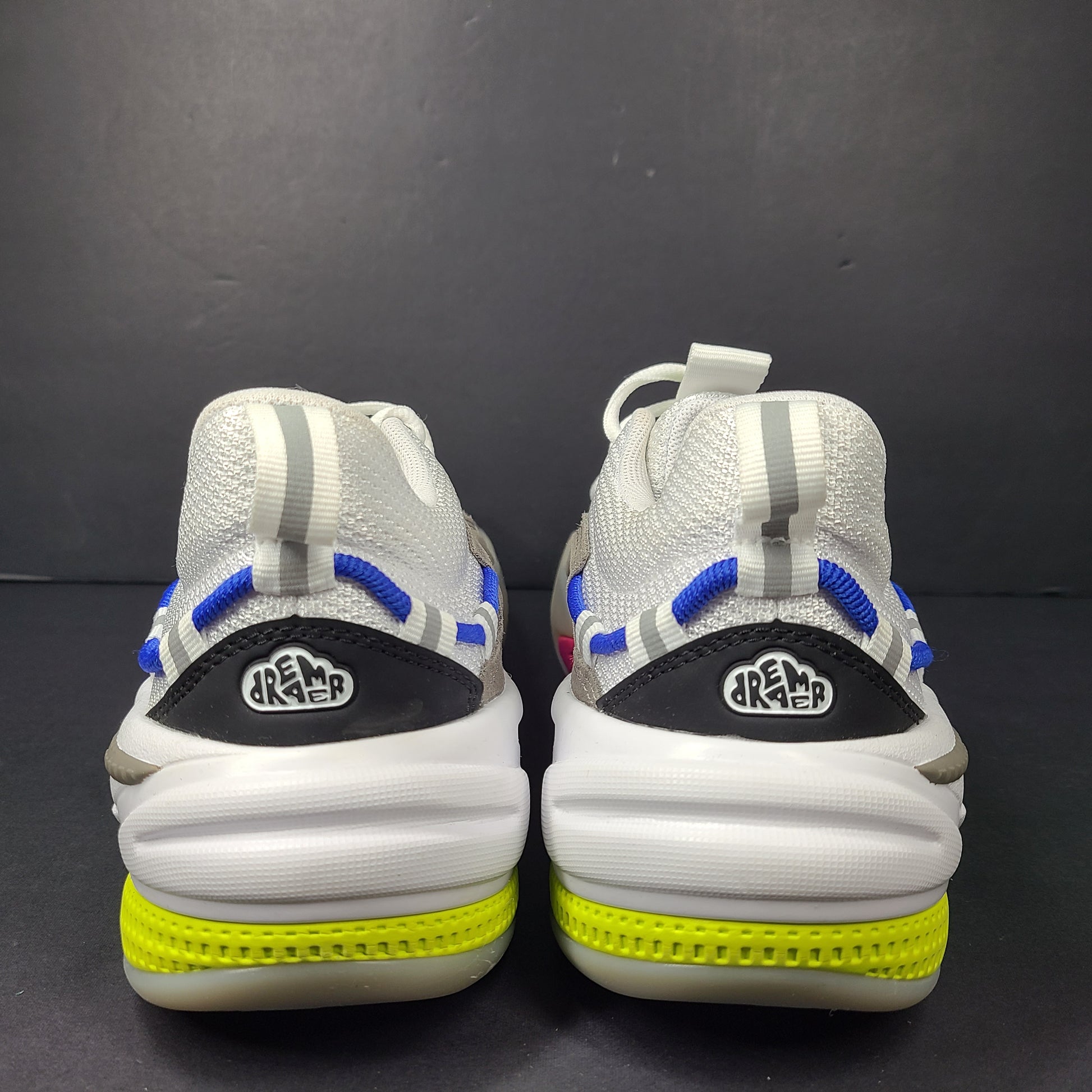 A pair of white, gray, blue, and pink PUMA RS-Dreamer sneakers for men