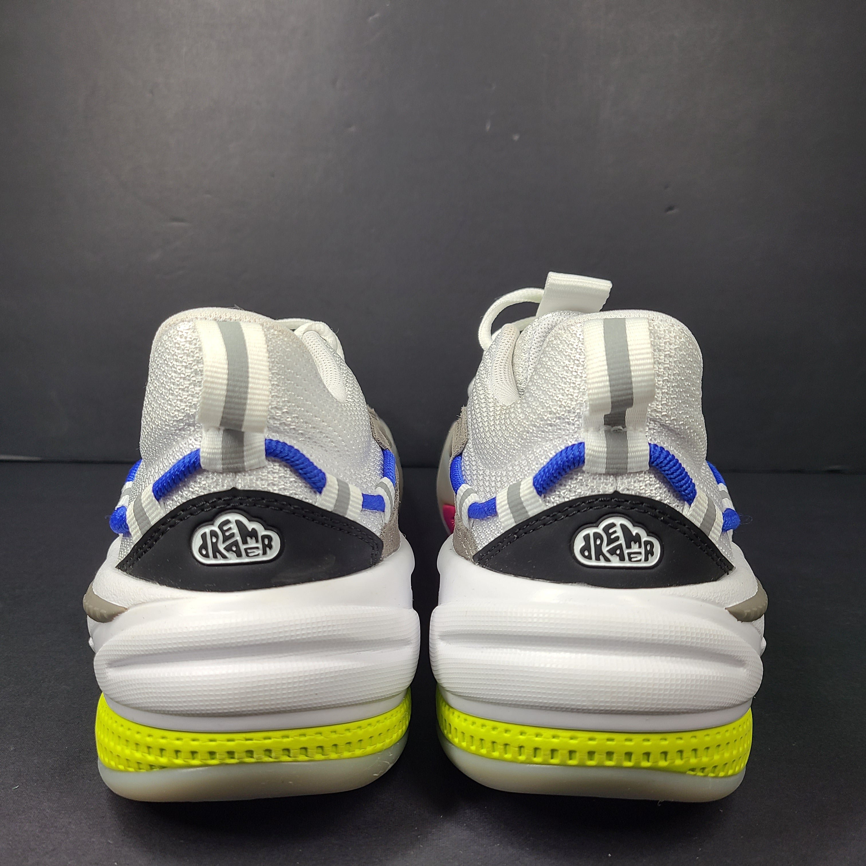 A pair of white, gray, blue, and pink PUMA RS-Dreamer sneakers for men