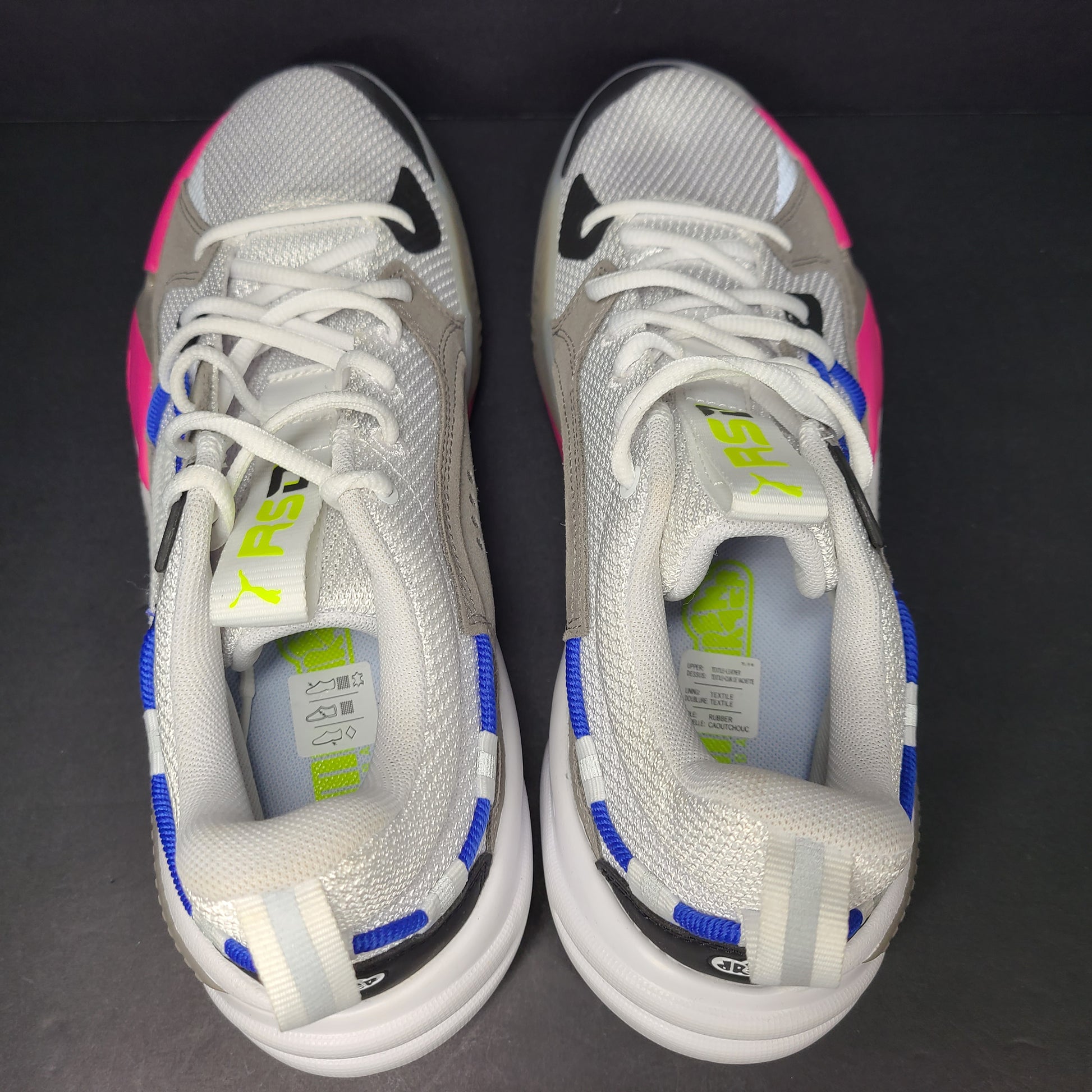 A pair of white, gray, blue, and pink PUMA RS-Dreamer sneakers for men