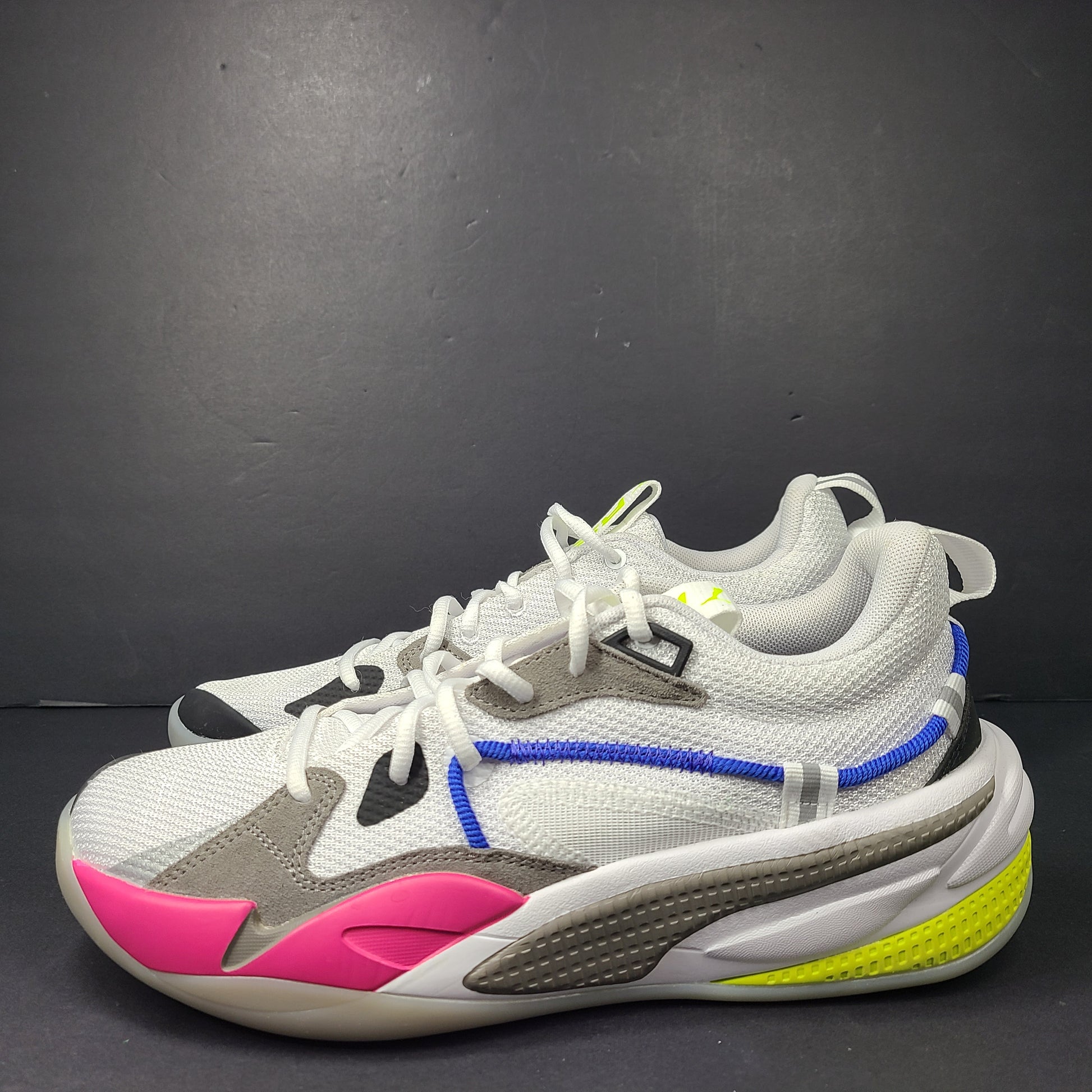 A pair of white, gray, blue, and pink PUMA RS-Dreamer sneakers for men