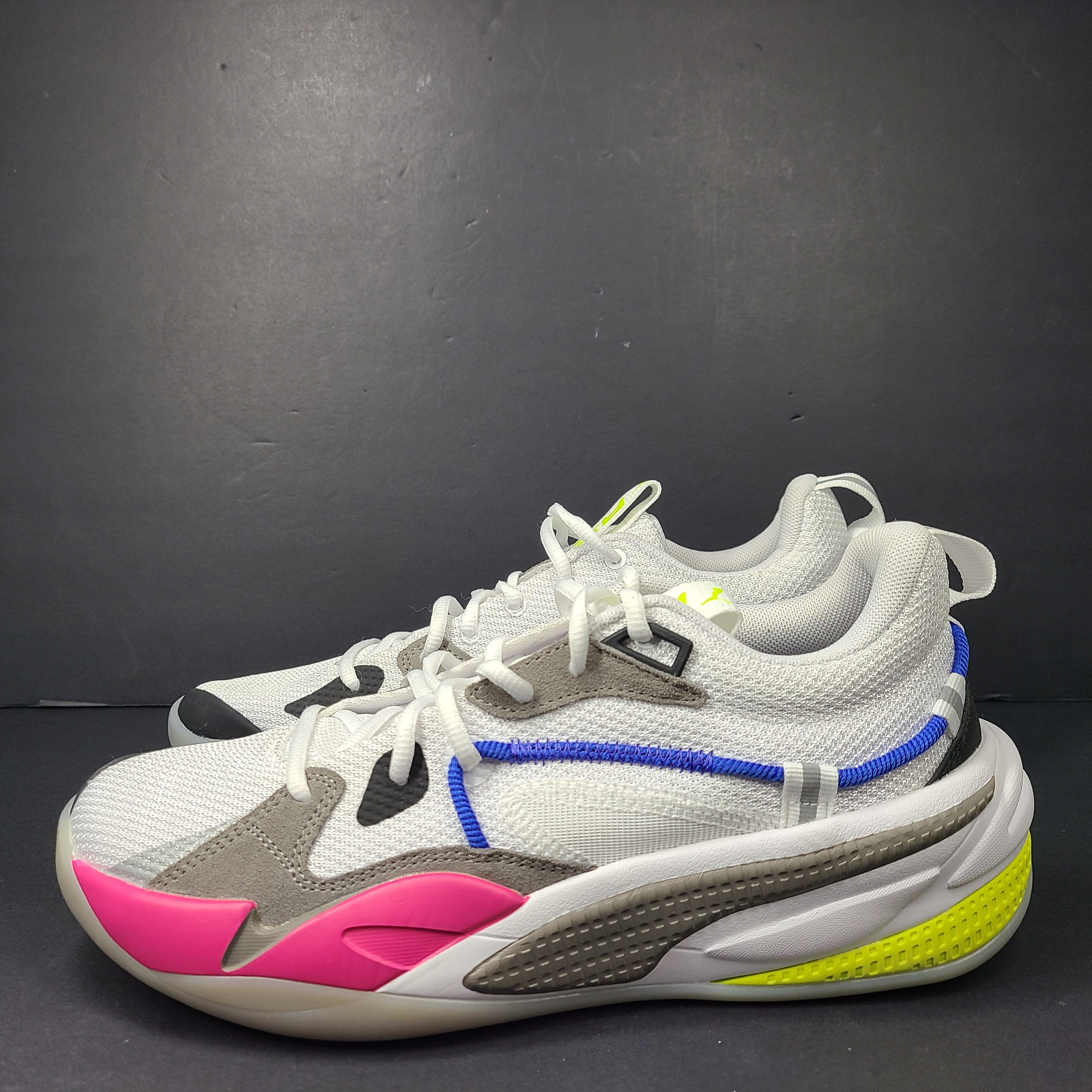 A pair of white, gray, blue, and pink PUMA RS-Dreamer sneakers for men