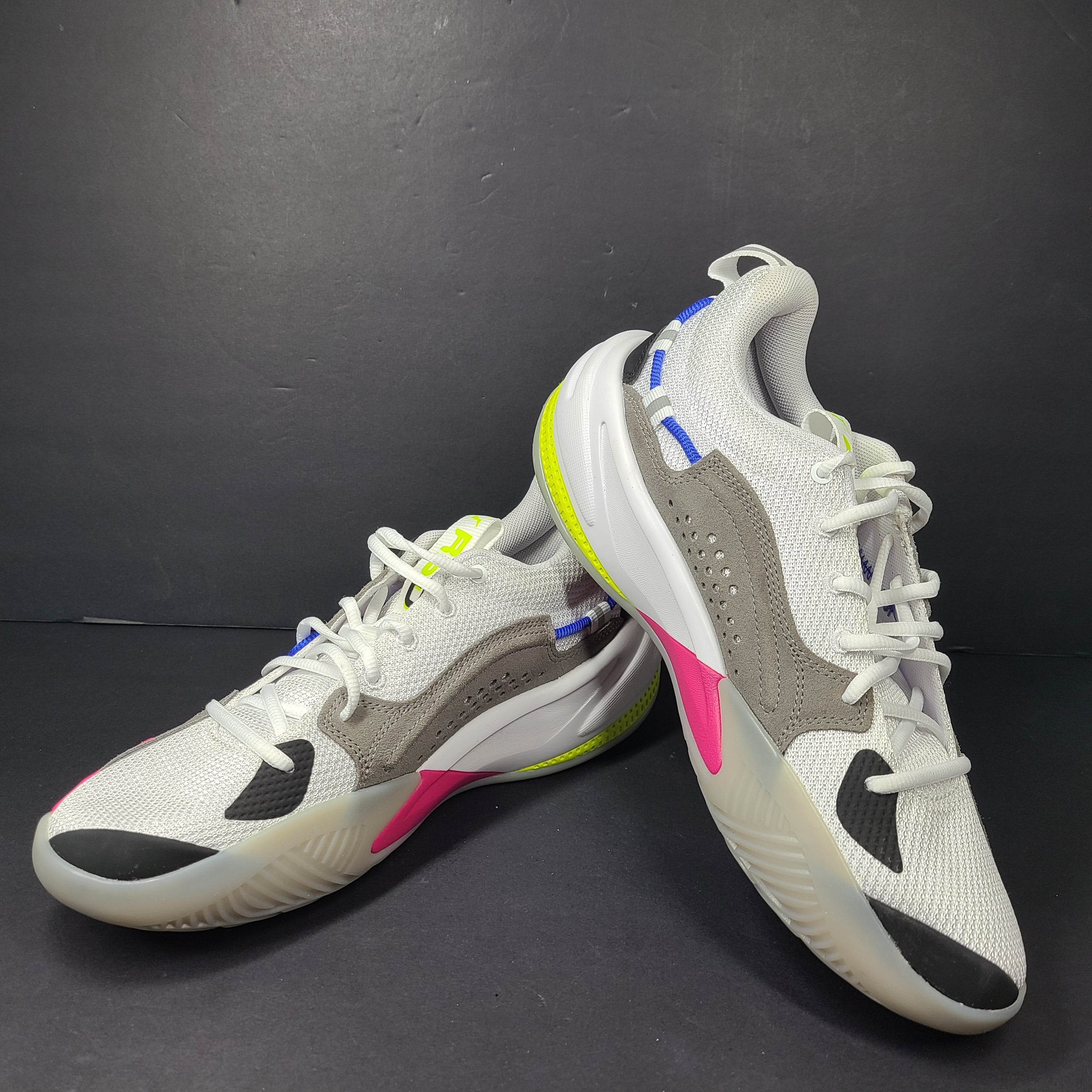 A pair of white, gray, blue, and pink PUMA RS-Dreamer sneakers for men