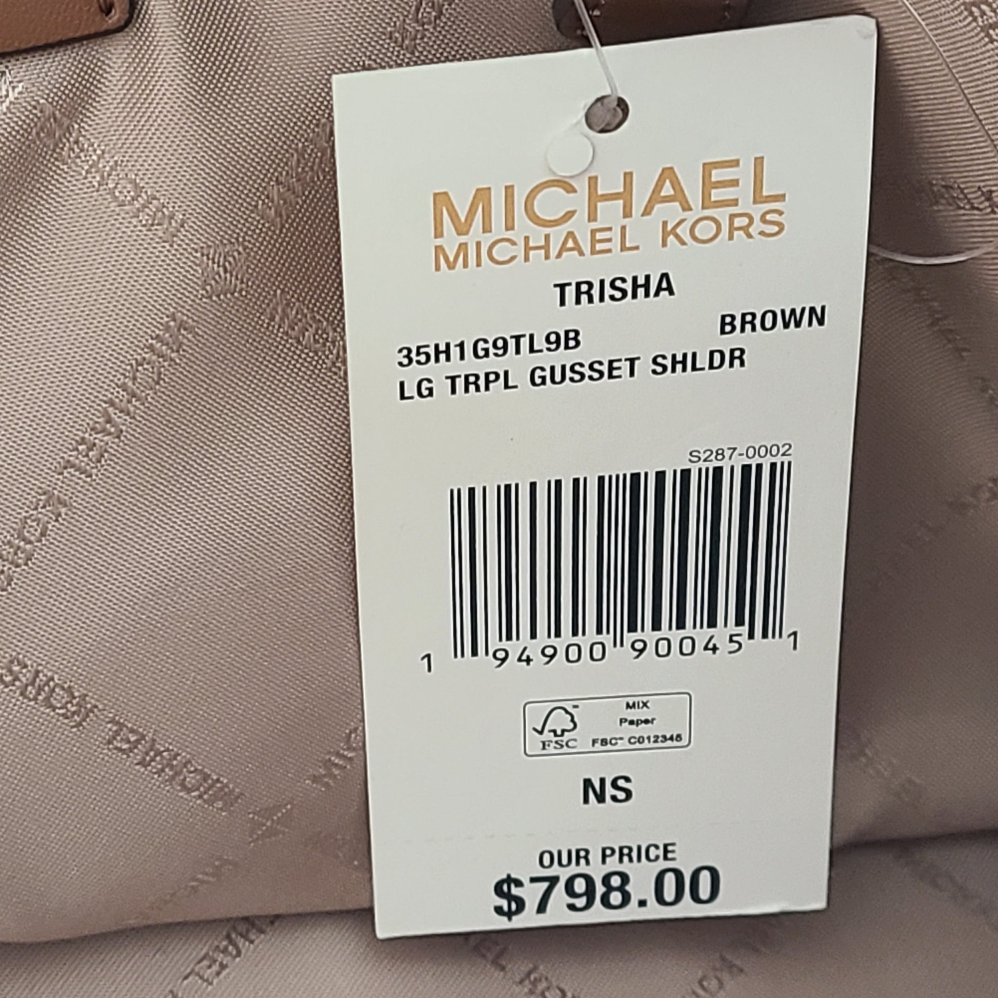 A stylish Michael Kors shoulder bag in brown color
