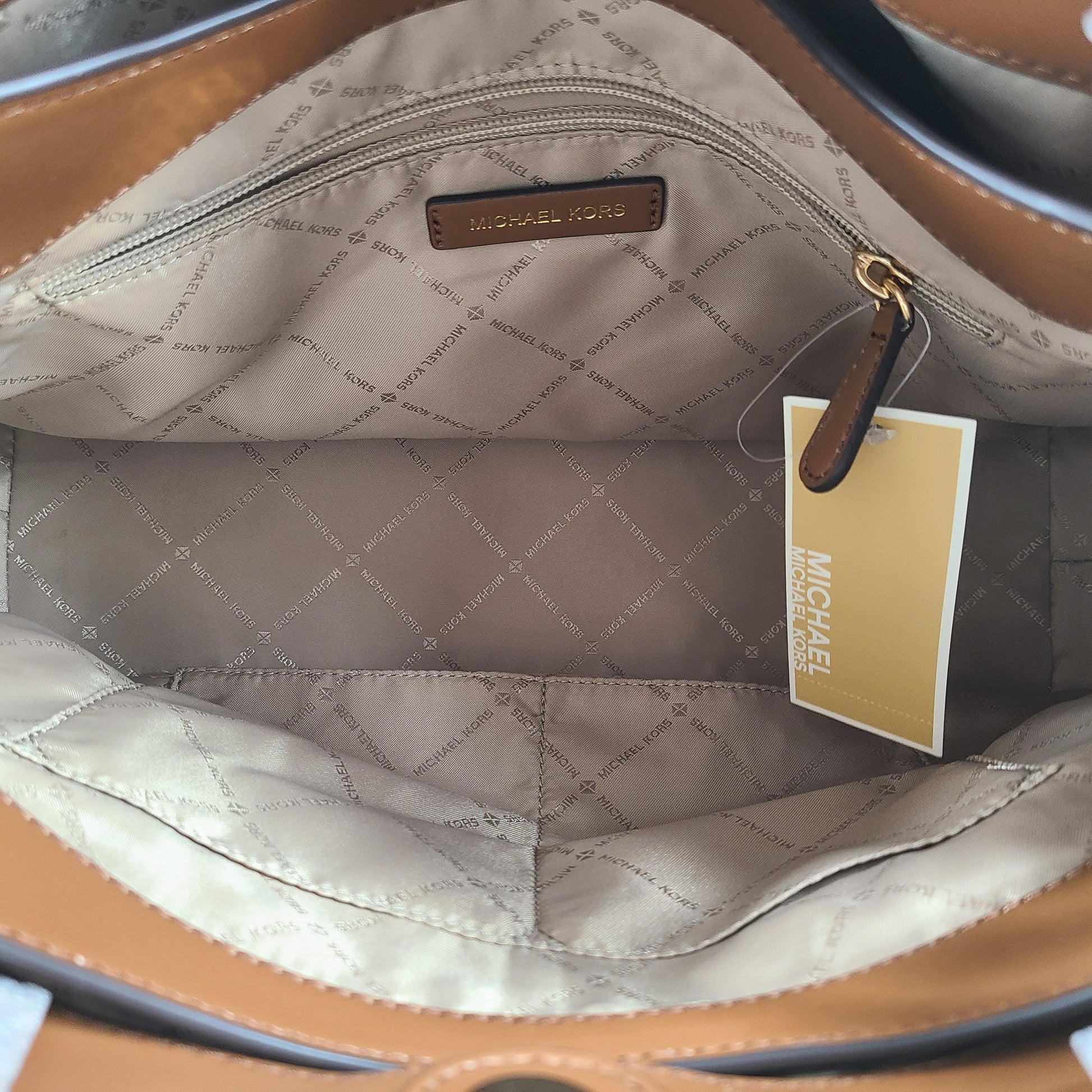 A stylish Michael Kors shoulder bag in brown color