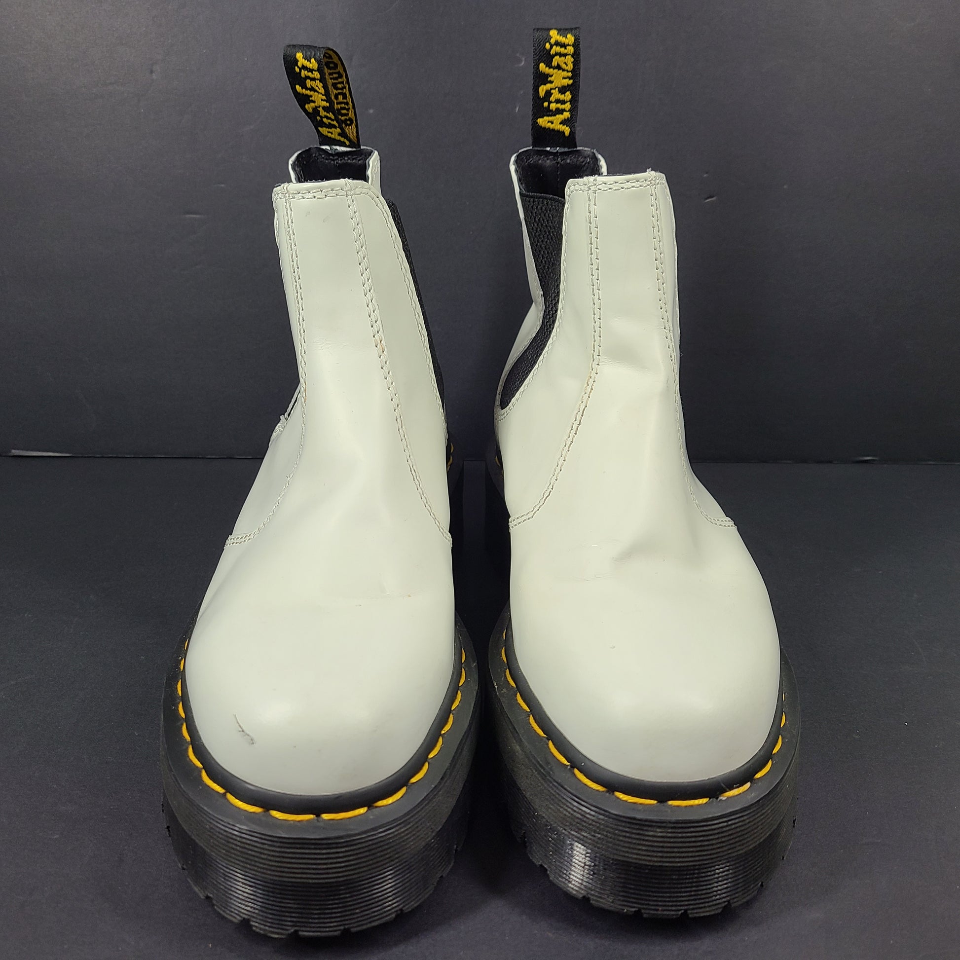 A pair of white Dr. Martens 2976 Quad Chelsea Boots.