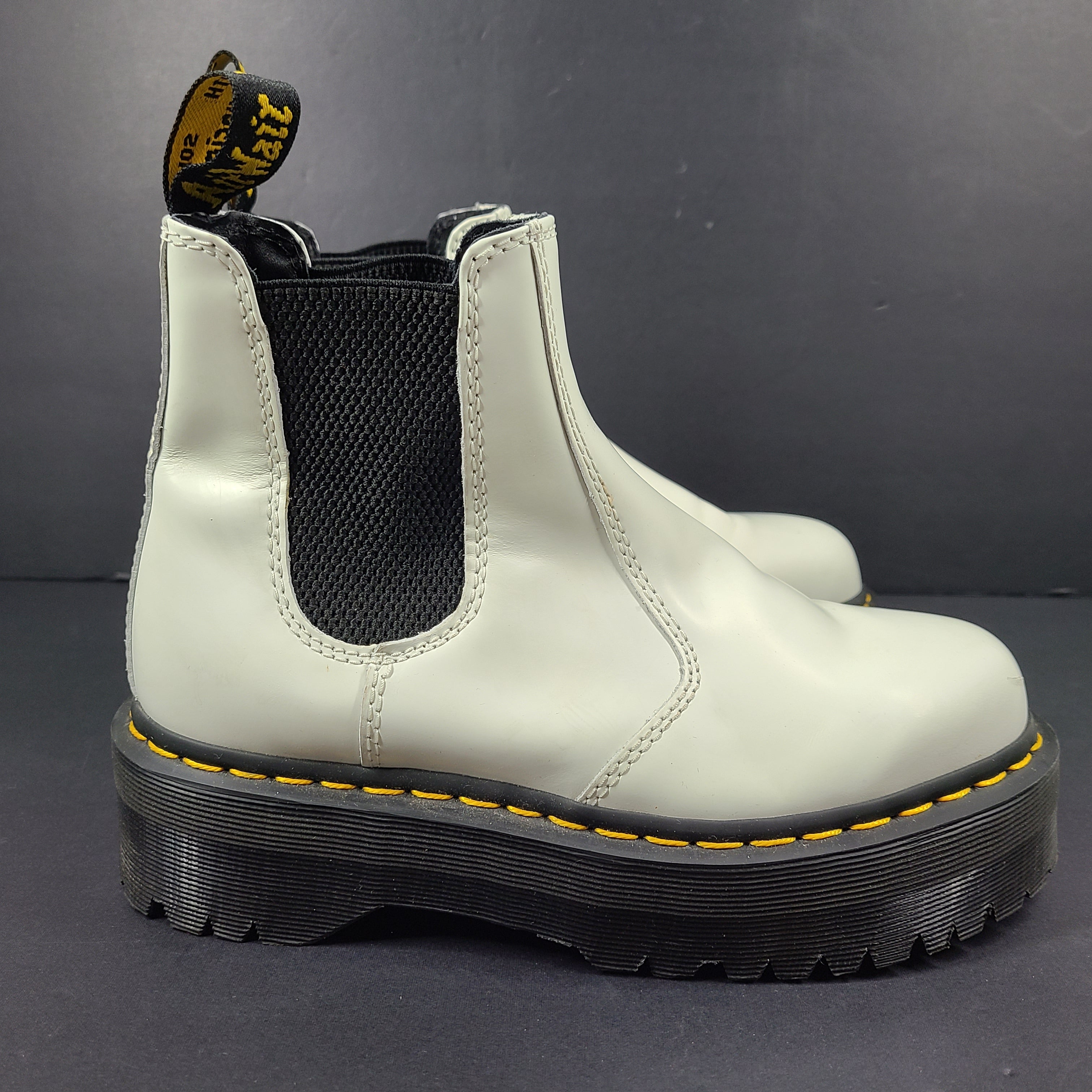 A pair of white Dr. Martens 2976 Quad Chelsea Boots.