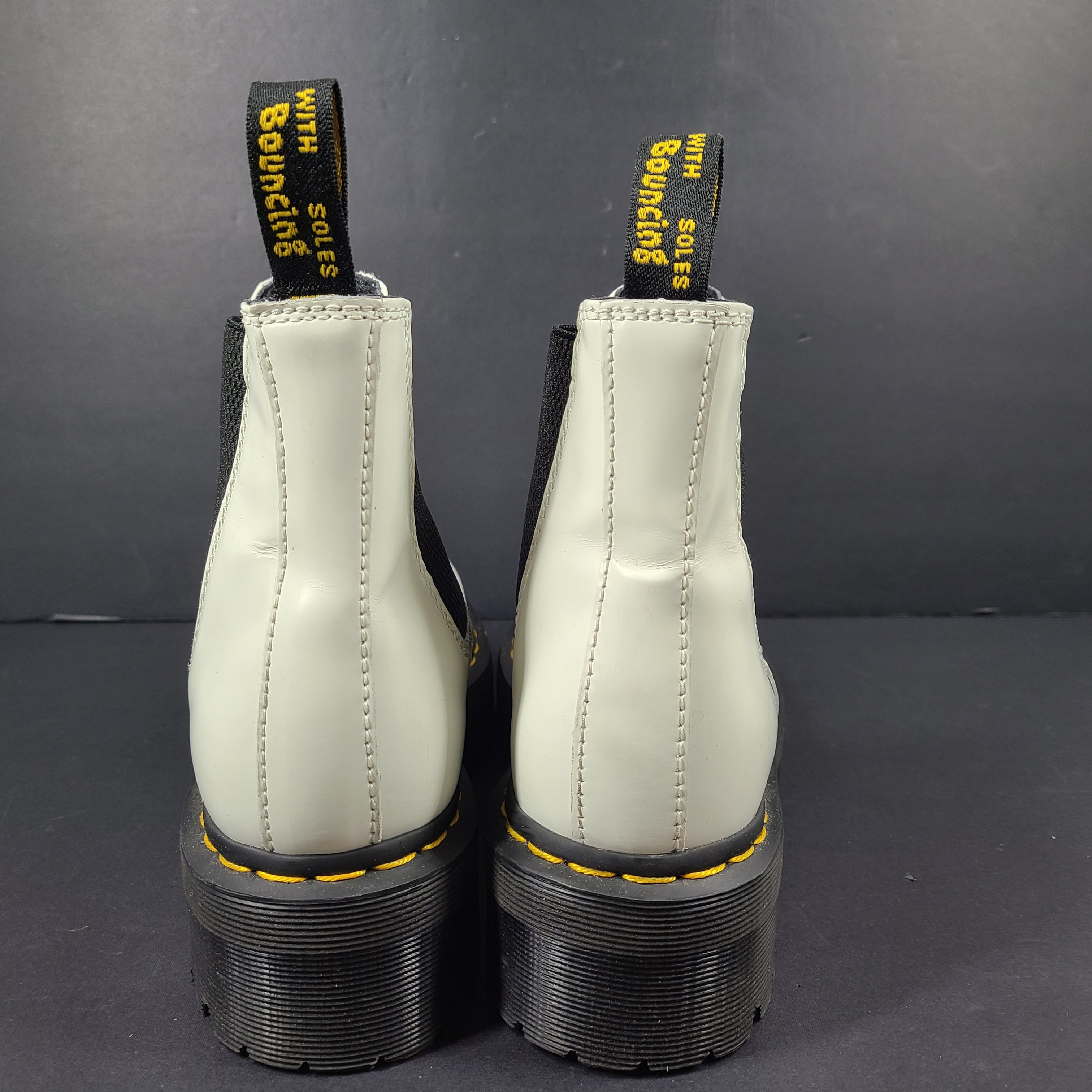 A pair of white Dr. Martens 2976 Quad Chelsea Boots.