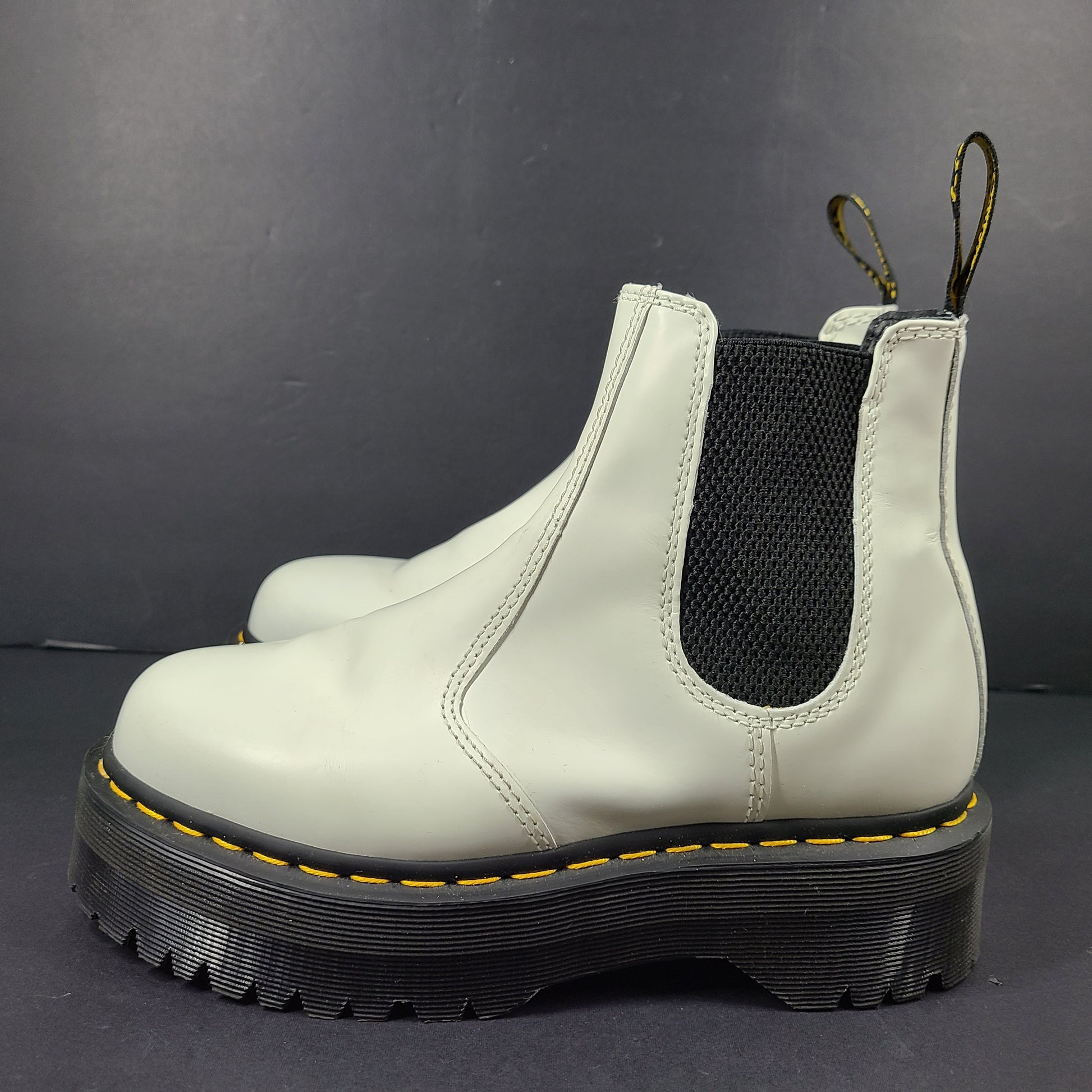 A pair of white Dr. Martens 2976 Quad Chelsea Boots.
