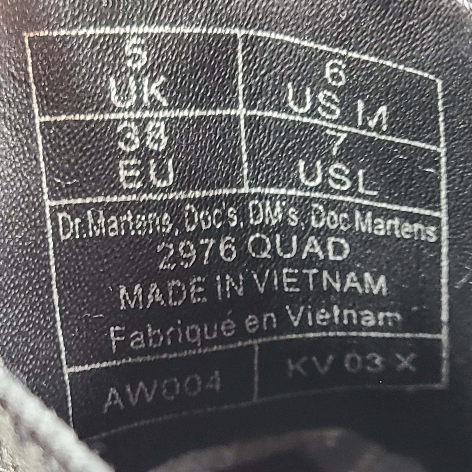 A pair of white Dr. Martens 2976 Quad Chelsea Boots.