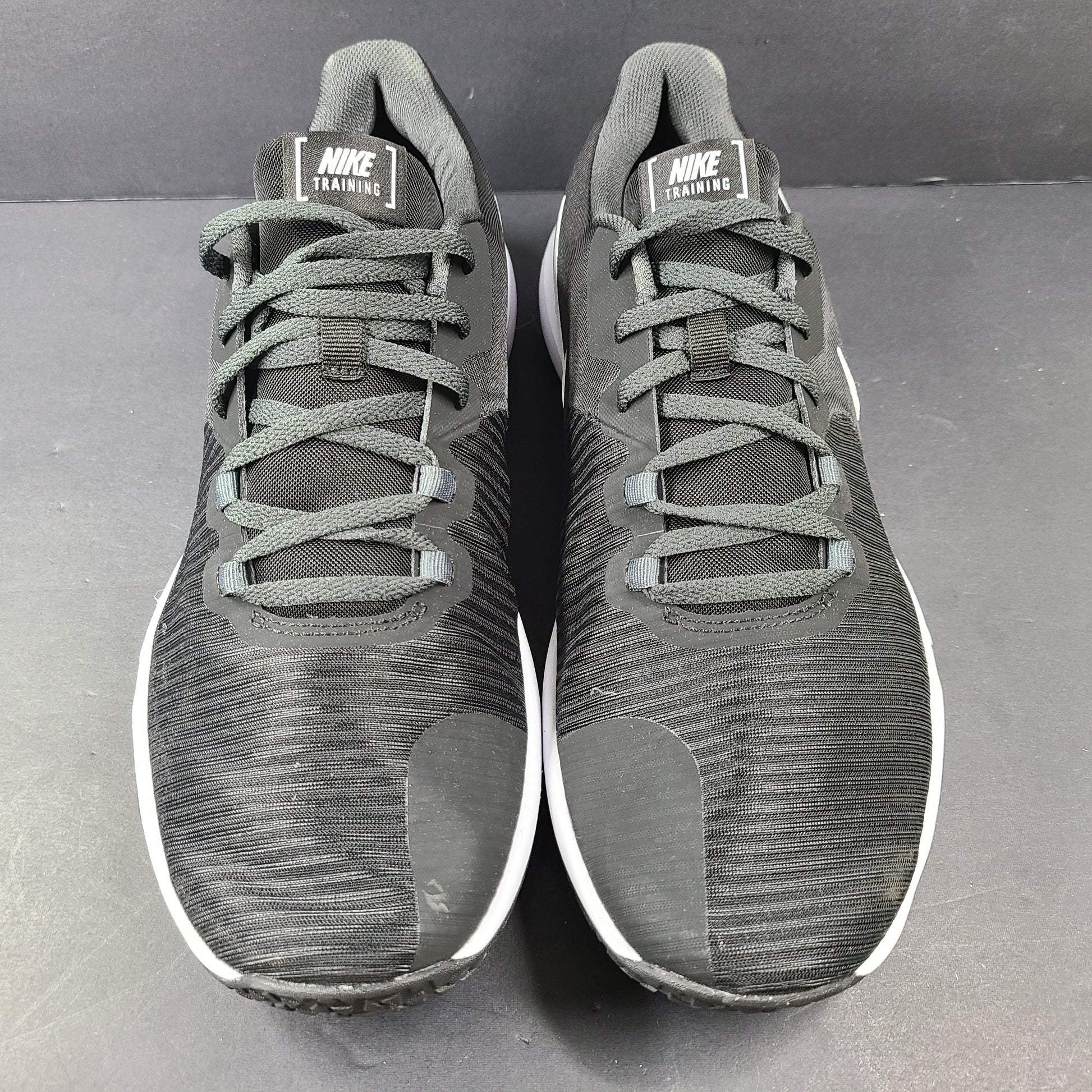 A pair of Nike Flex Training Shoes in Black and White