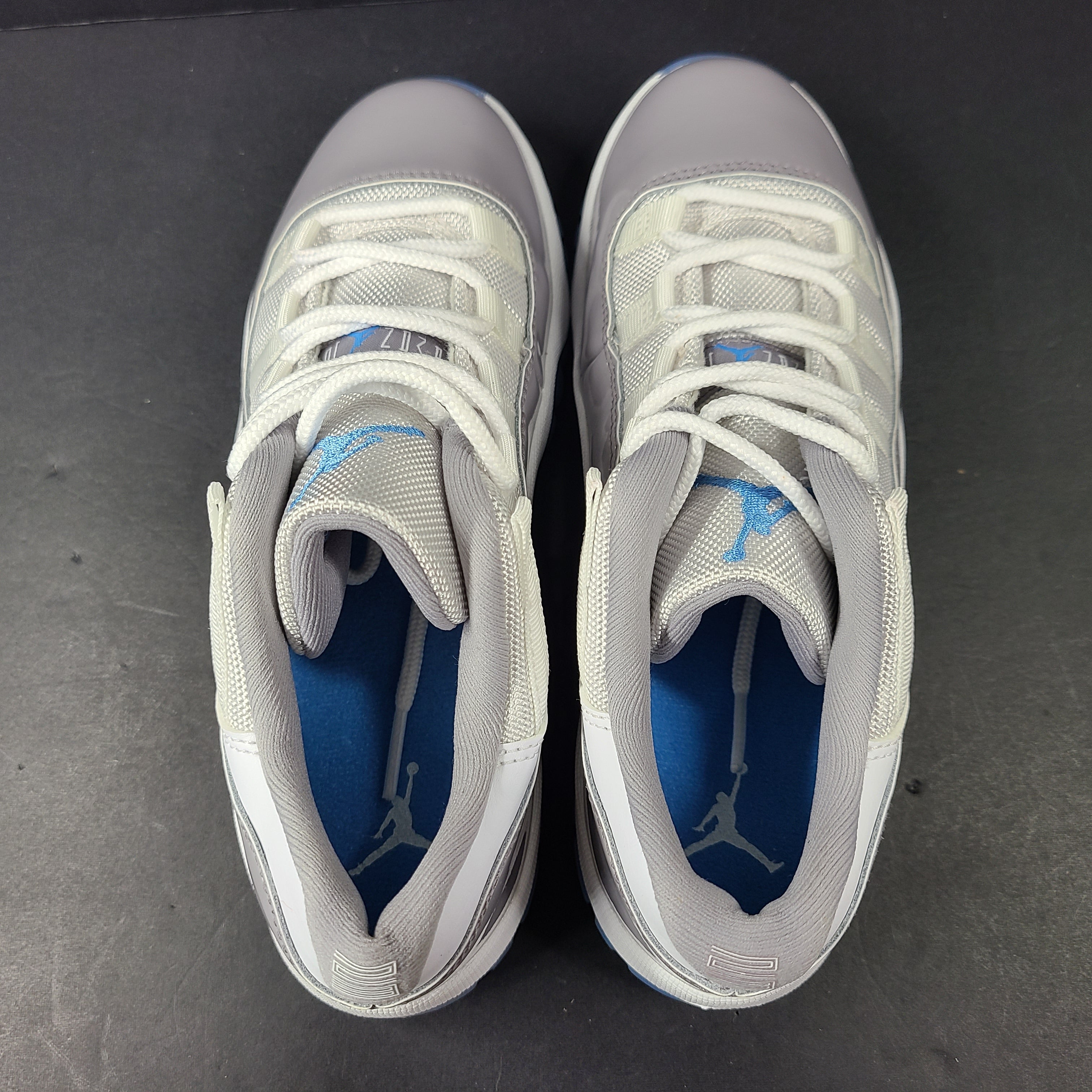 A pair of Nike Air Jordan 11 Retro Low Gray Blue Youth Size 3Y sneakers.