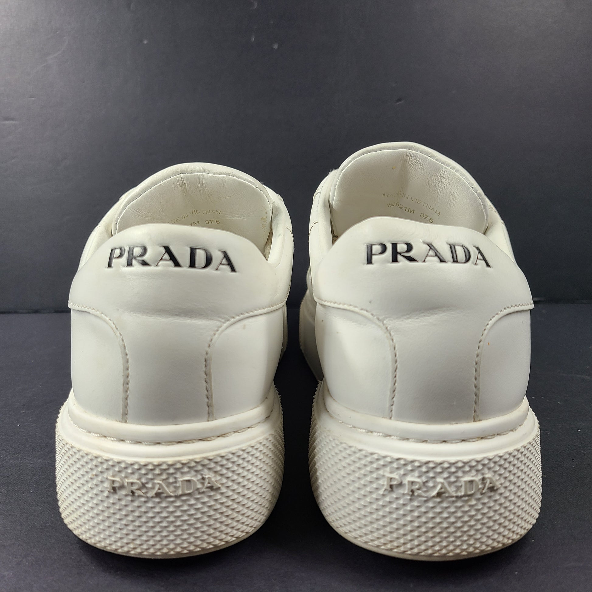 Stylish white Prada Milano leather sneakers in size 37.5