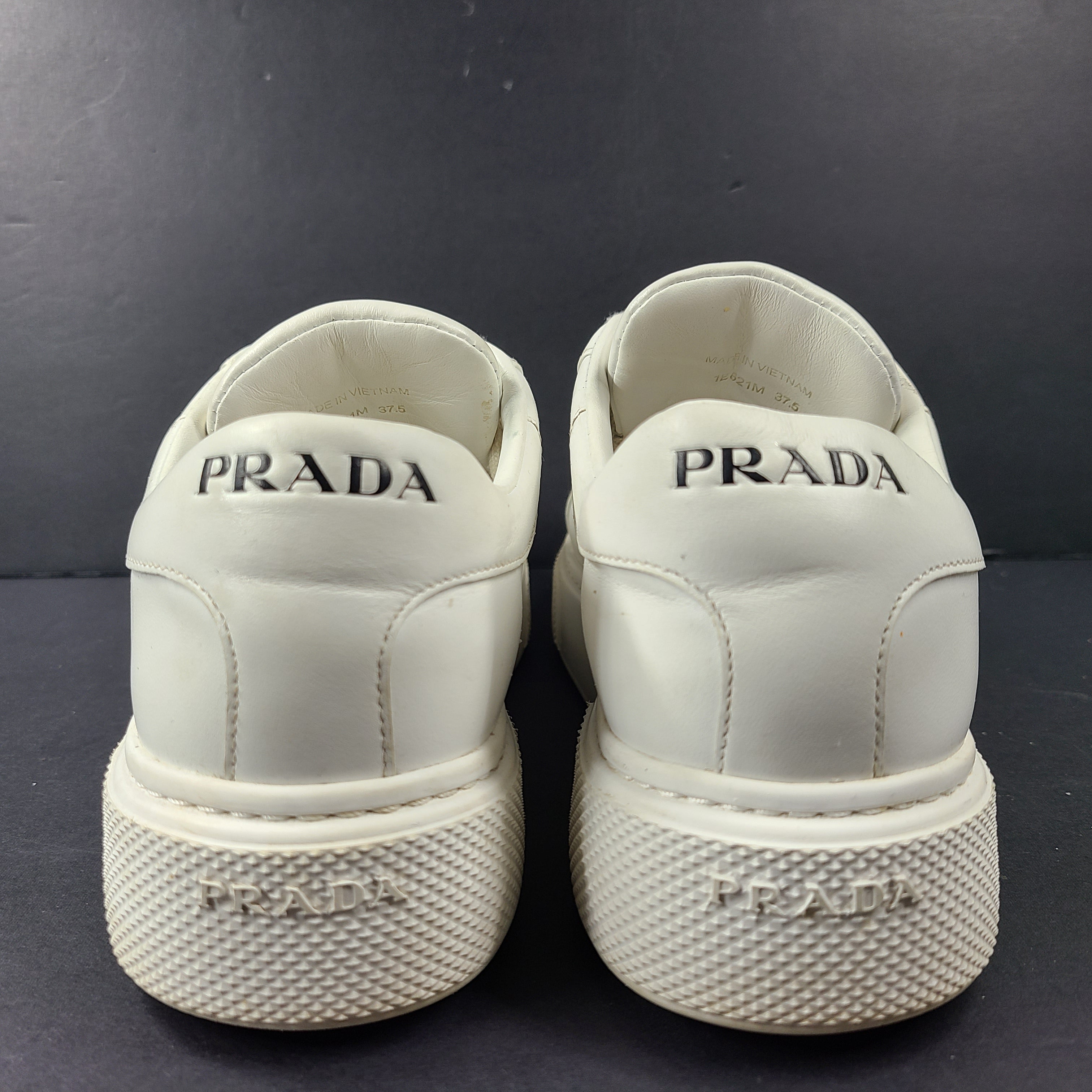 Stylish white Prada Milano leather sneakers in size 37.5