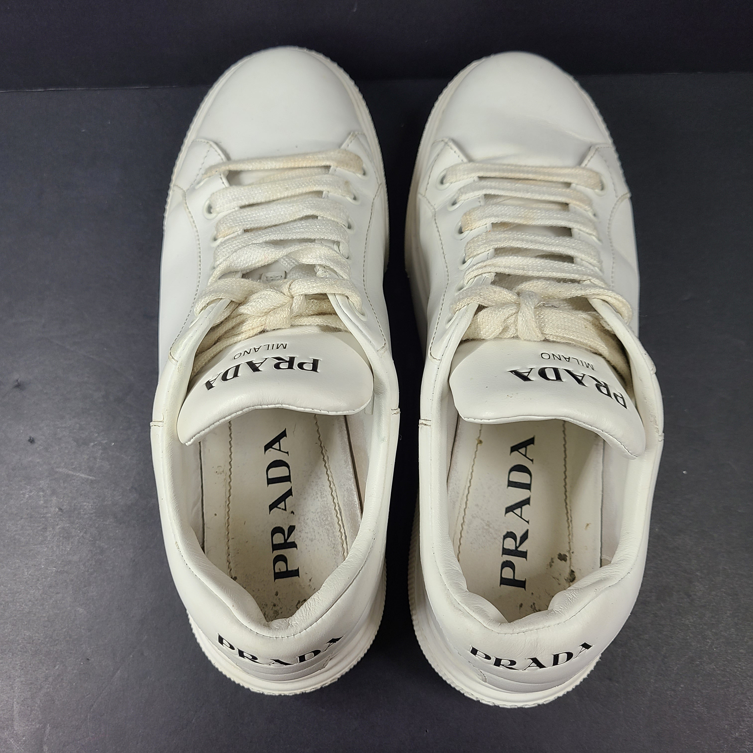 Stylish white Prada Milano leather sneakers in size 37.5