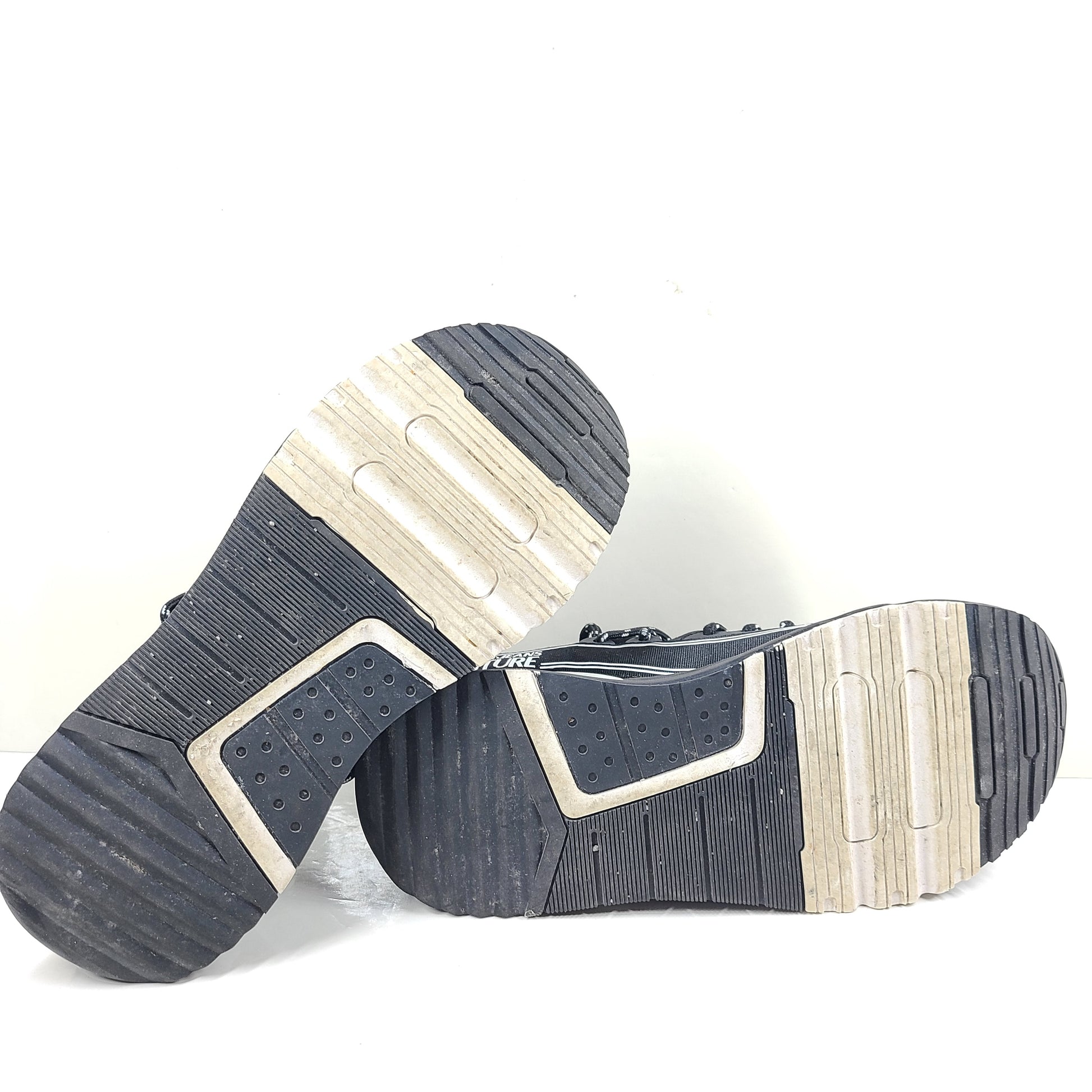 A pair of Versace Jeans Couture black sneakers with slight wear.