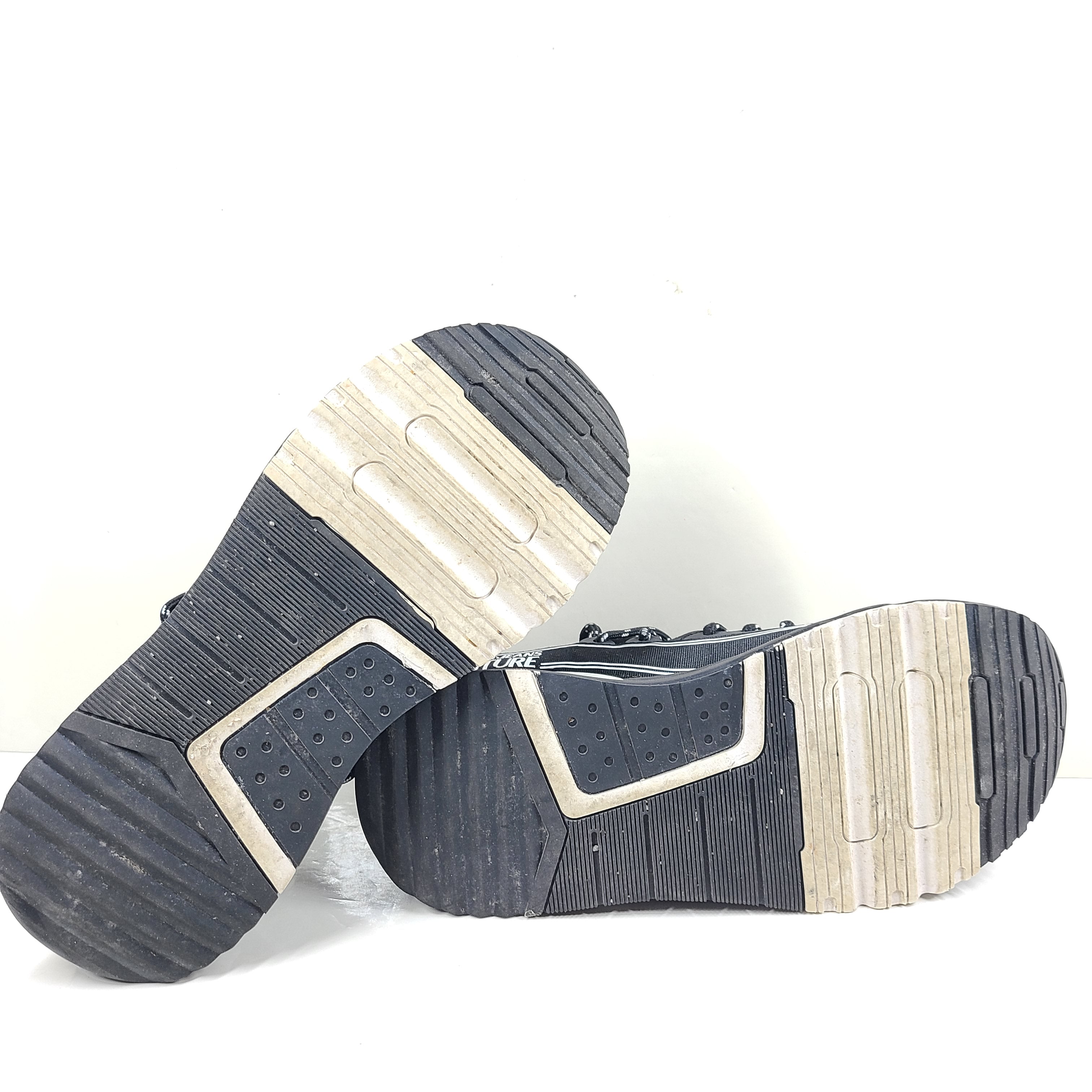 A pair of Versace Jeans Couture black sneakers with slight wear.