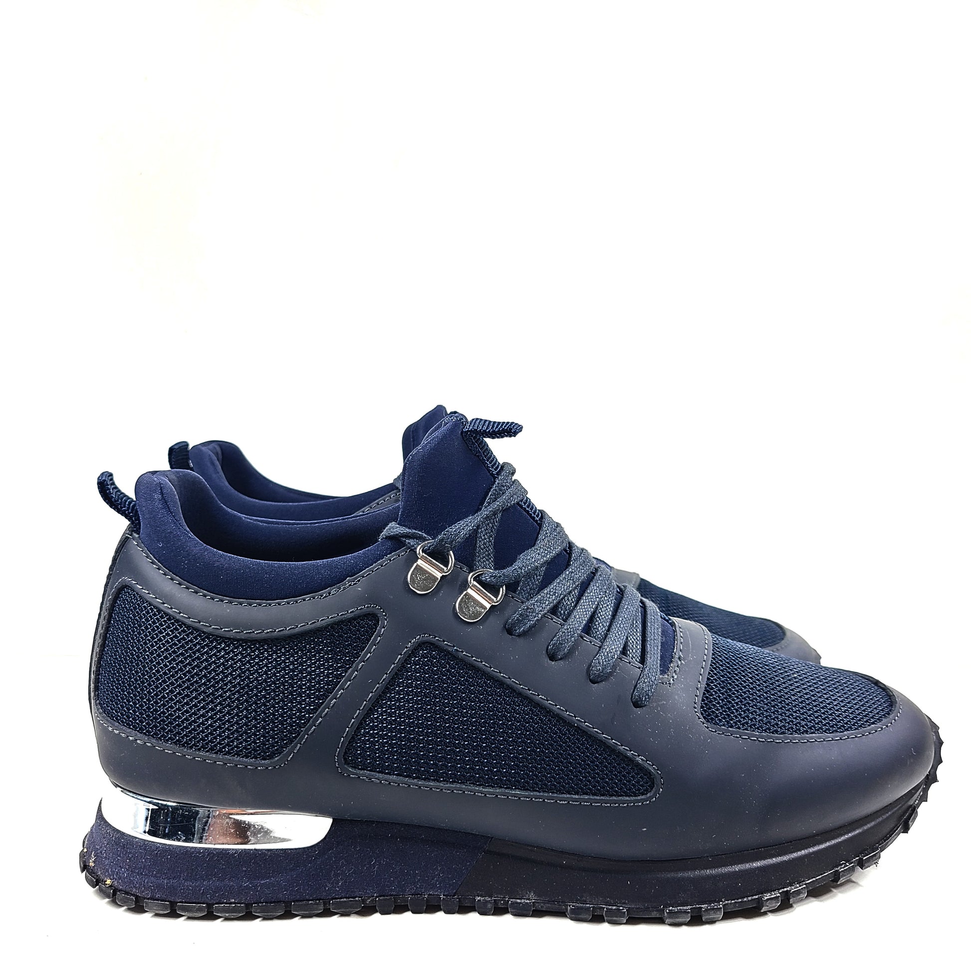 A pair of navy blue mesh and leather sneakers by Mallet.