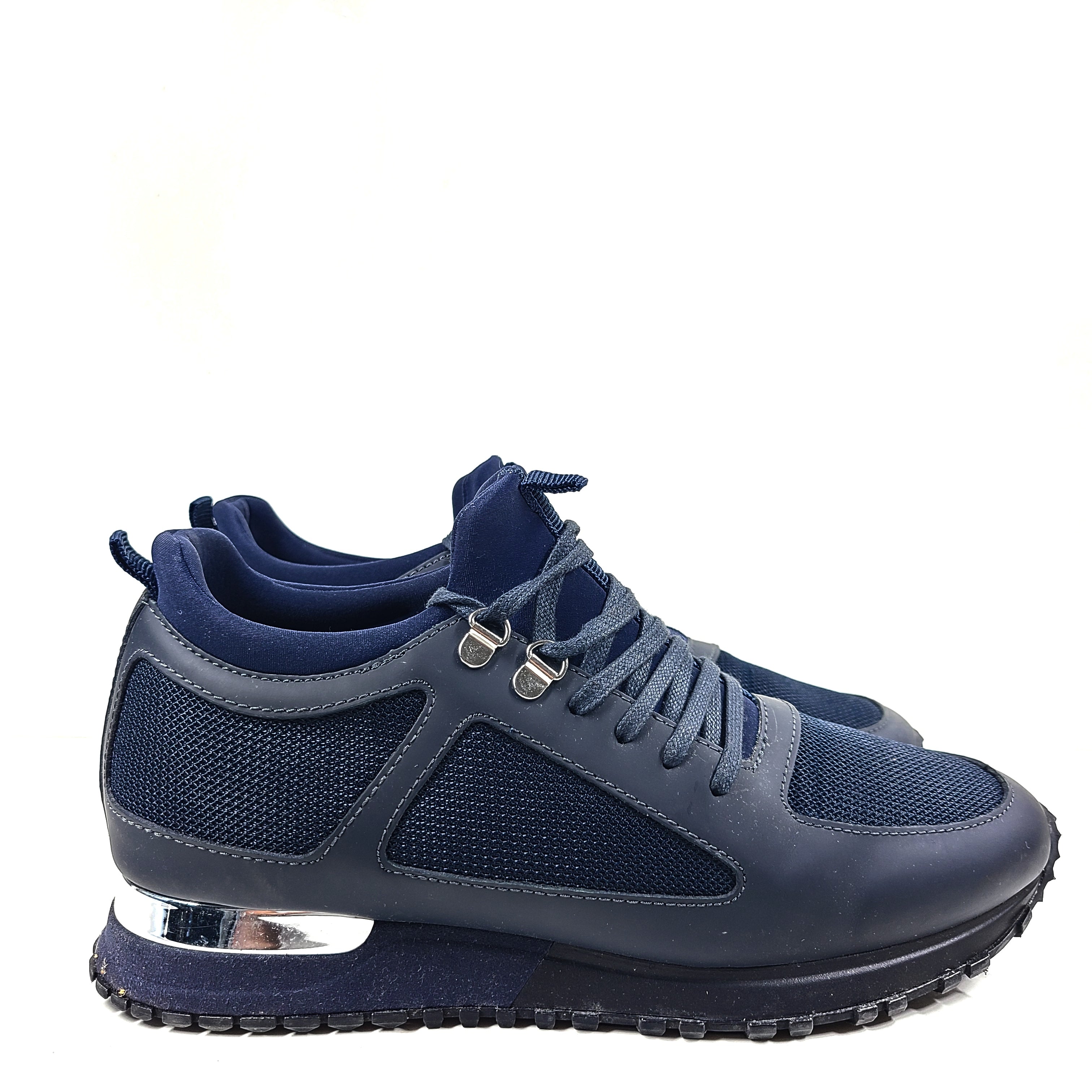 A pair of navy blue mesh and leather sneakers by Mallet.