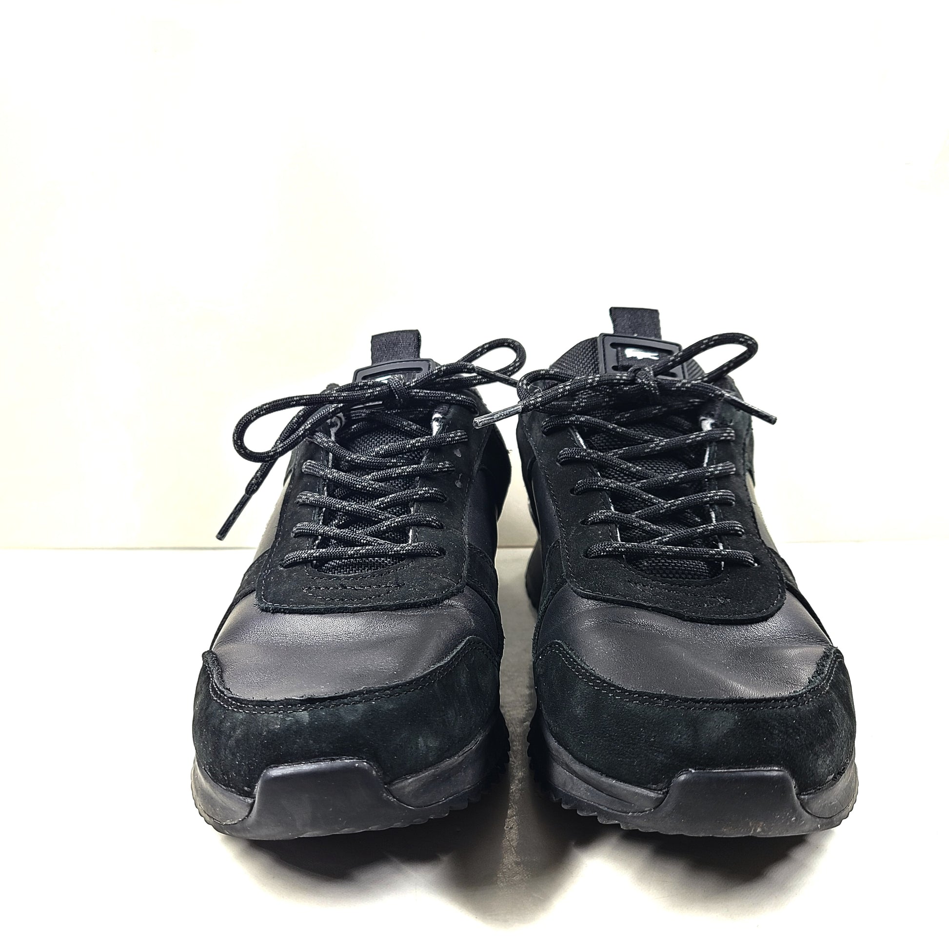 A pair of black Lacoste Joggeur 2.0 sneakers for men in size 10.