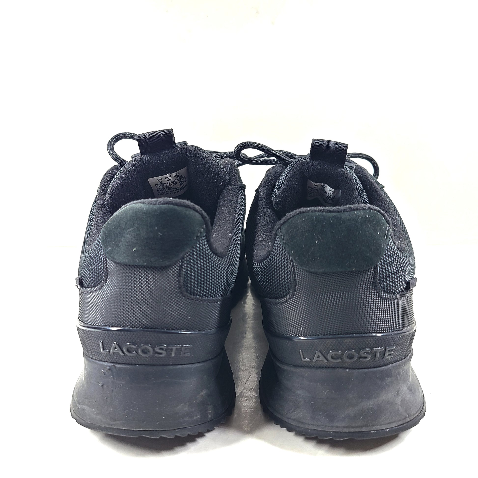 A pair of black Lacoste Joggeur 2.0 sneakers for men in size 10.
