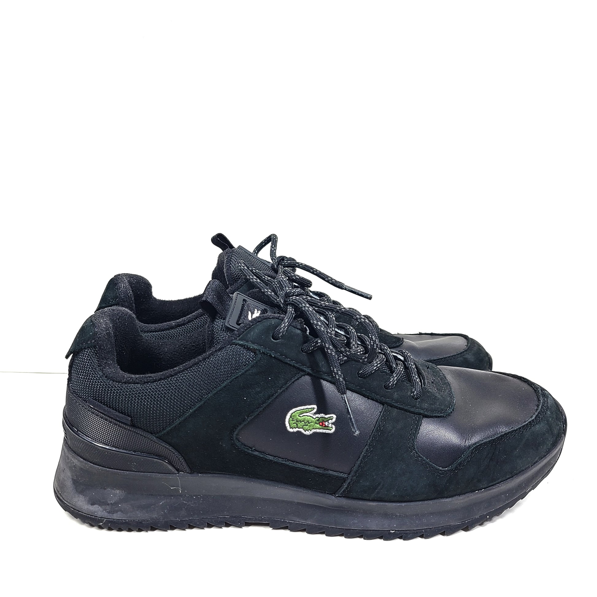 A pair of black Lacoste Joggeur 2.0 sneakers for men in size 10.
