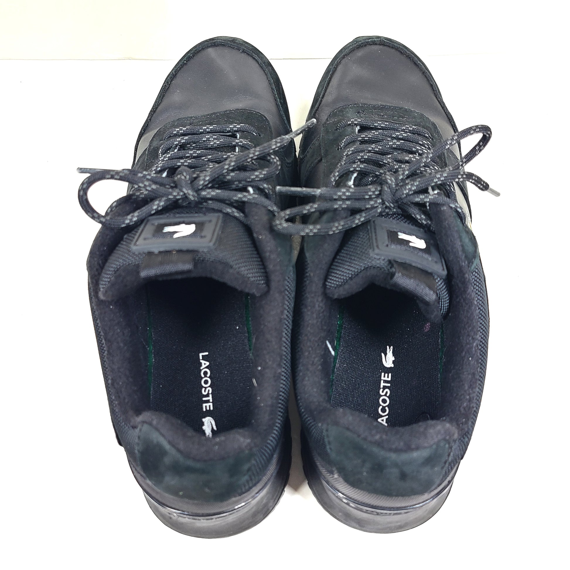 A pair of black Lacoste Joggeur 2.0 sneakers for men in size 10.