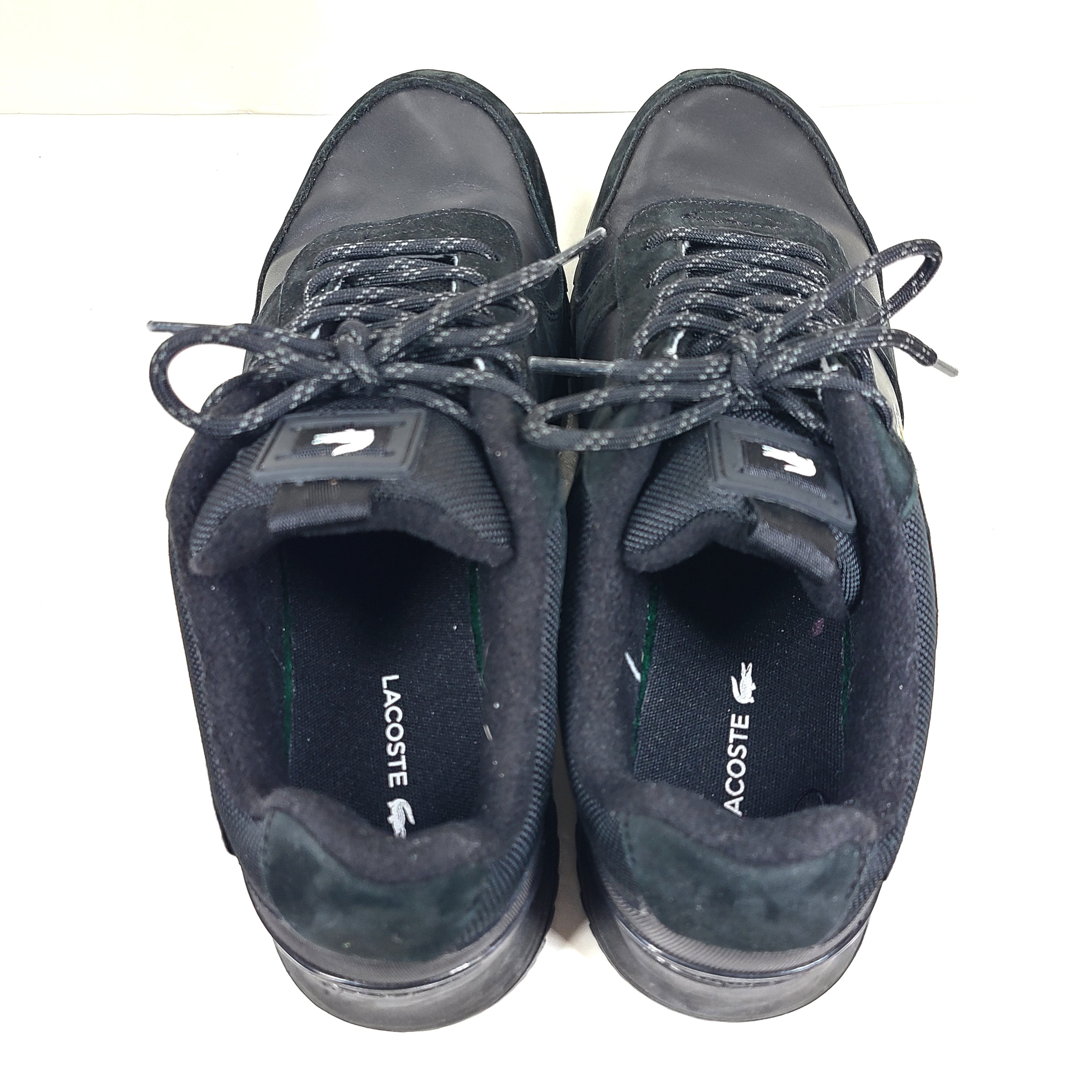 A pair of black Lacoste Joggeur 2.0 sneakers for men in size 10.