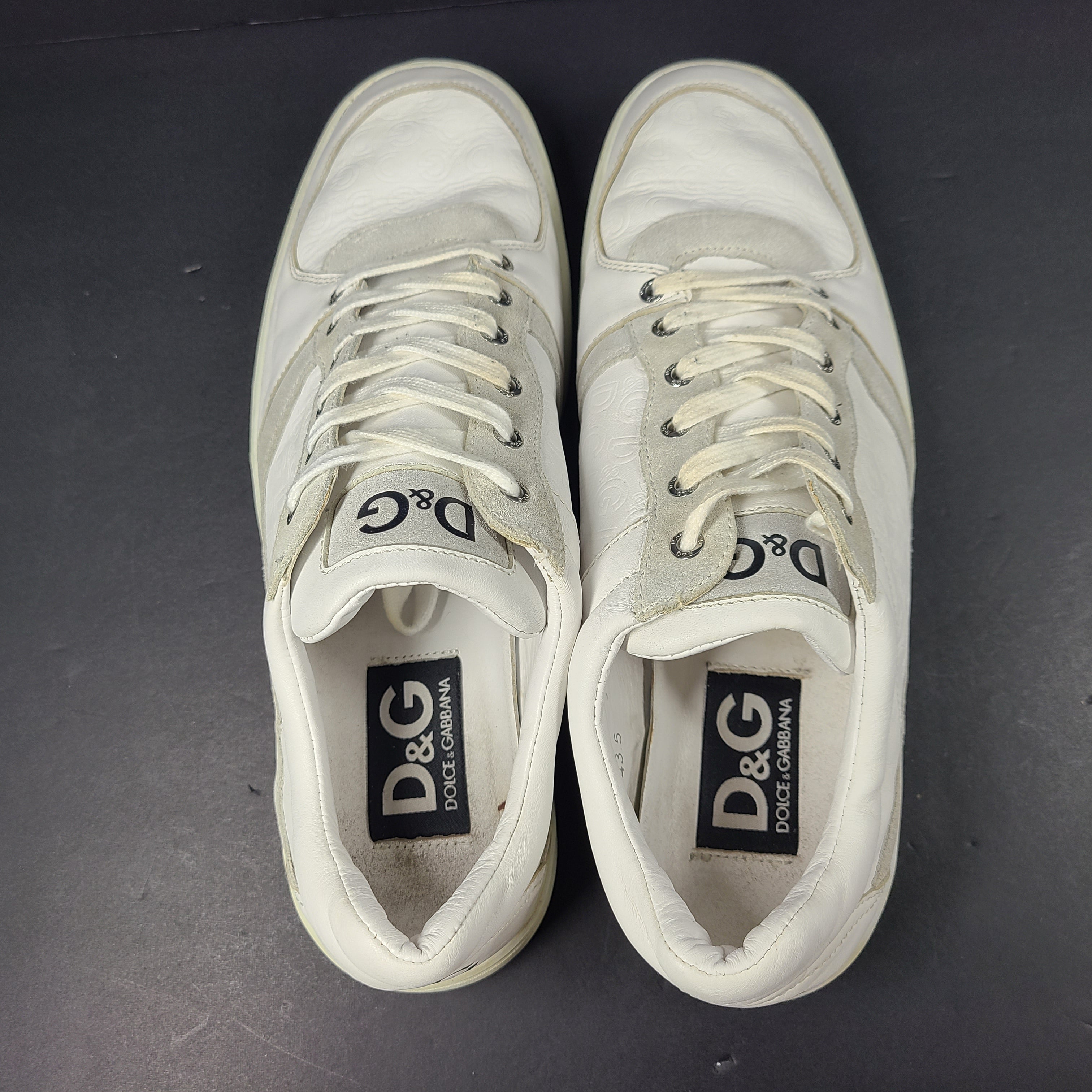 A pair of white D&G Dolce & Gabbana sneakers