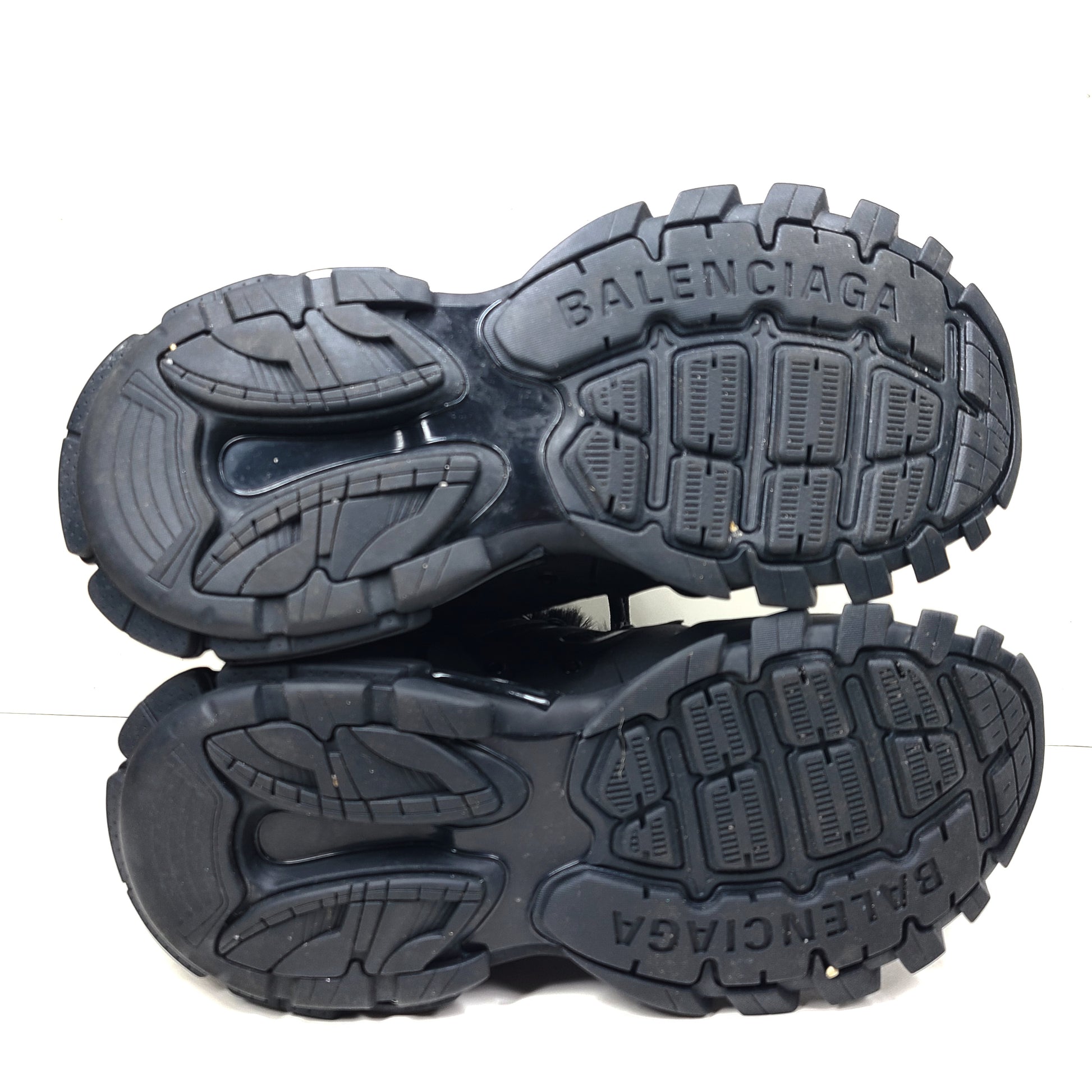 A pair of stylish men's black Balenciaga Track Sneakers with fur lining