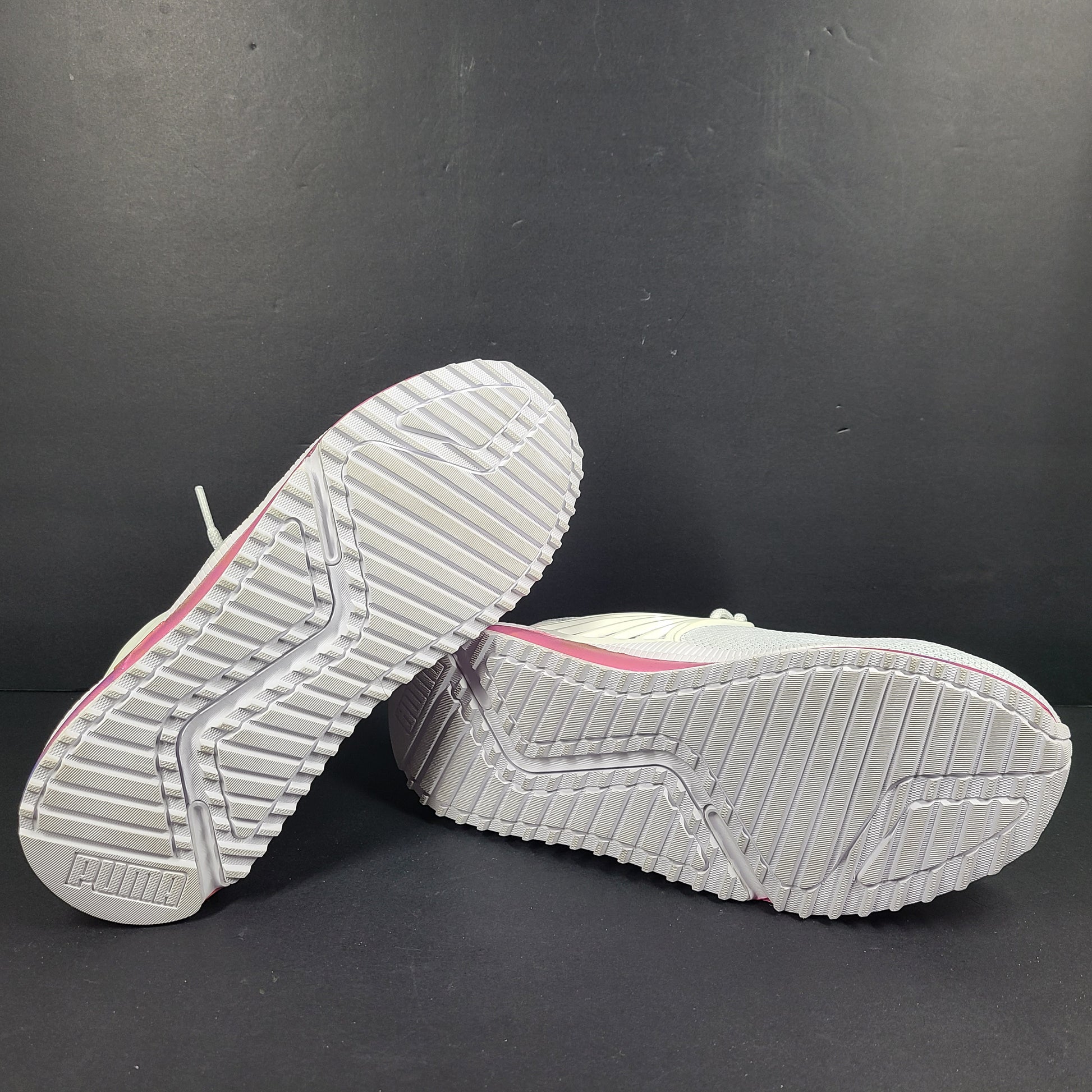 A pair of Puma Women's SoftFoam Sneakers in White and Multicolor