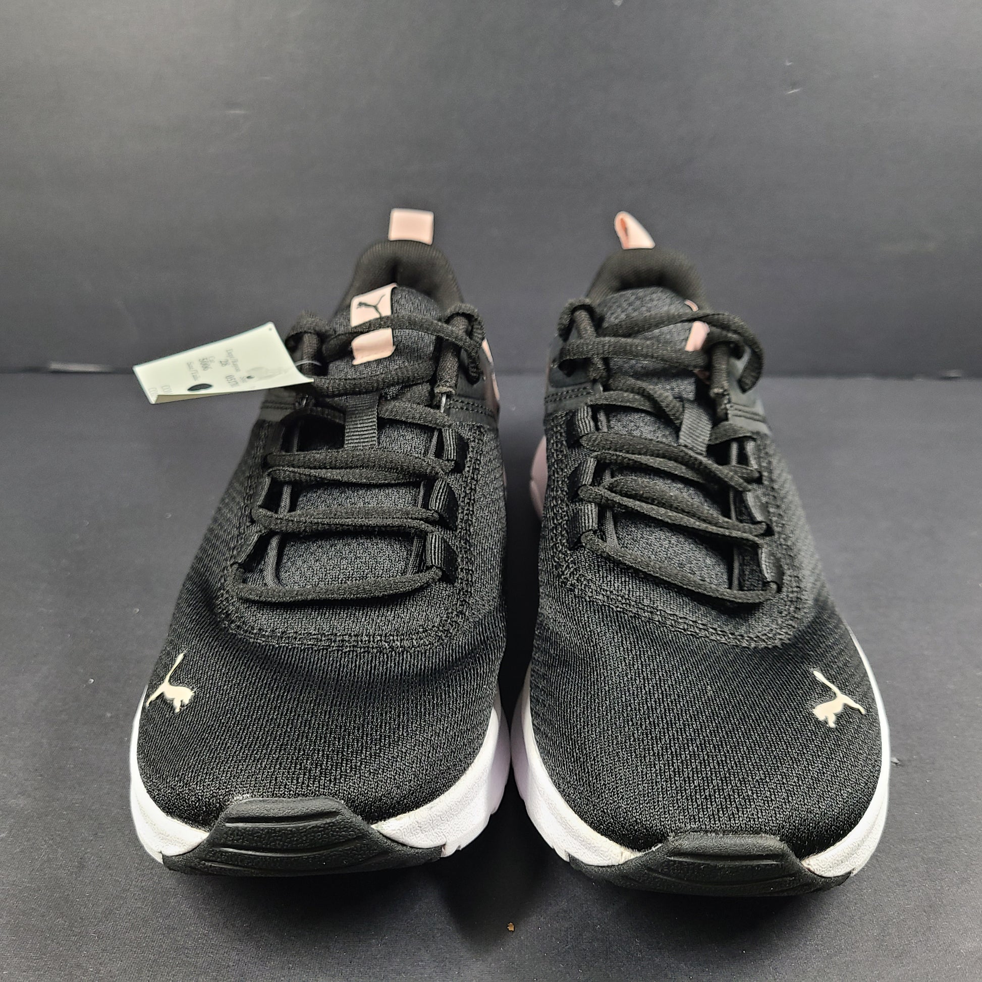 A pair of Puma black and pink sneakers with SoftFoam technology