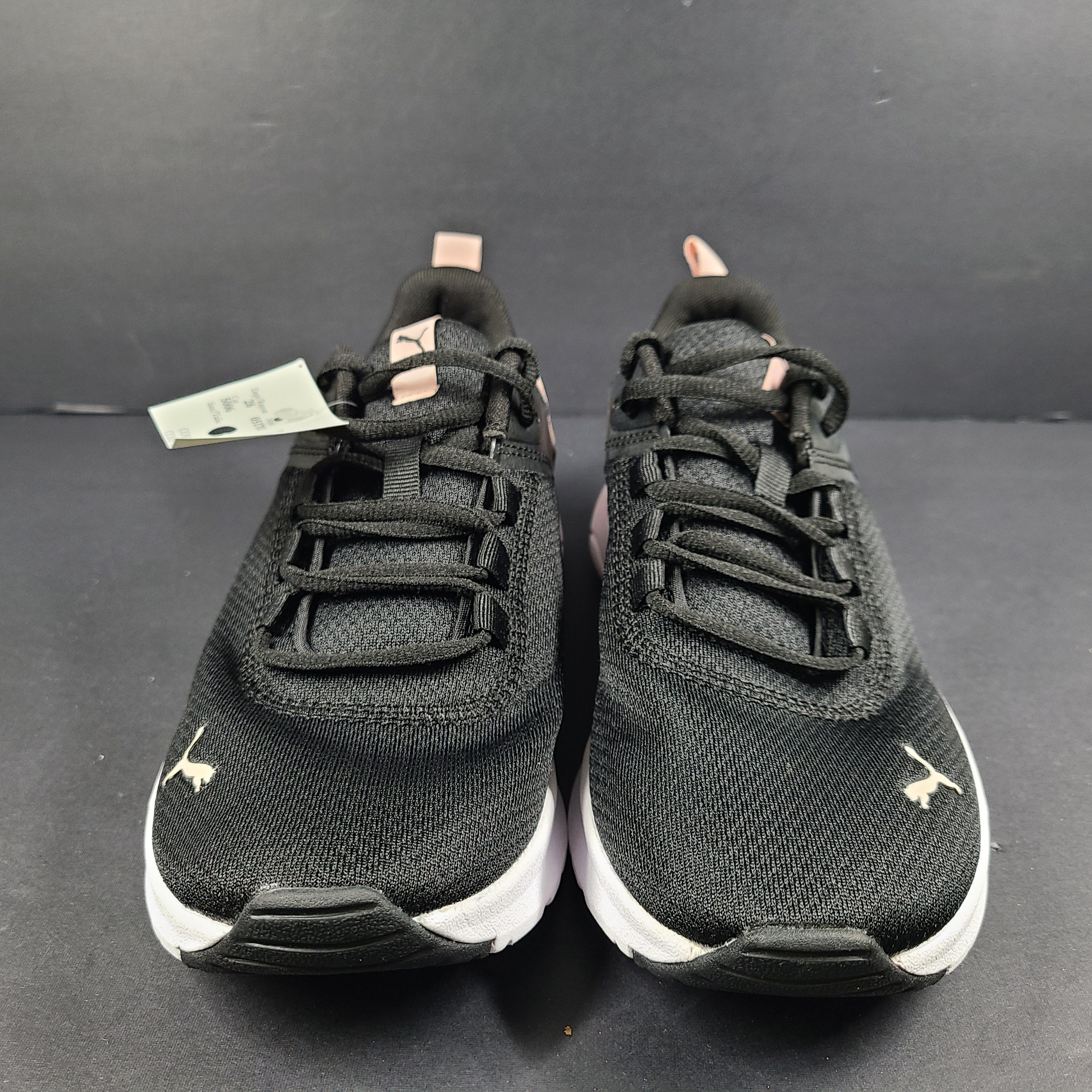 A pair of Puma black and pink sneakers with SoftFoam technology