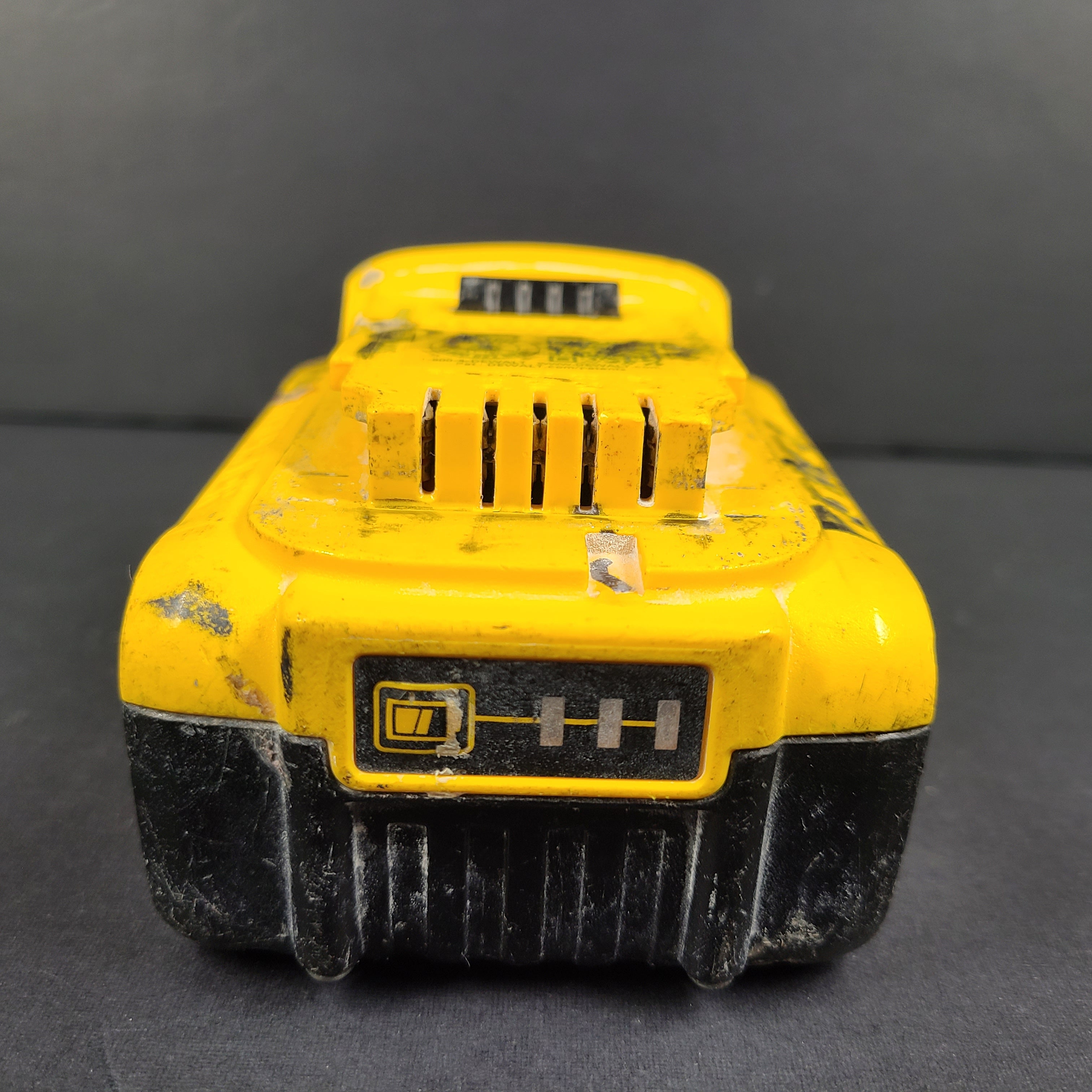 A pre-owned DeWalt XR Lithium-Ion Battery 20V Max 4Ah N089668 with noticeable wear.