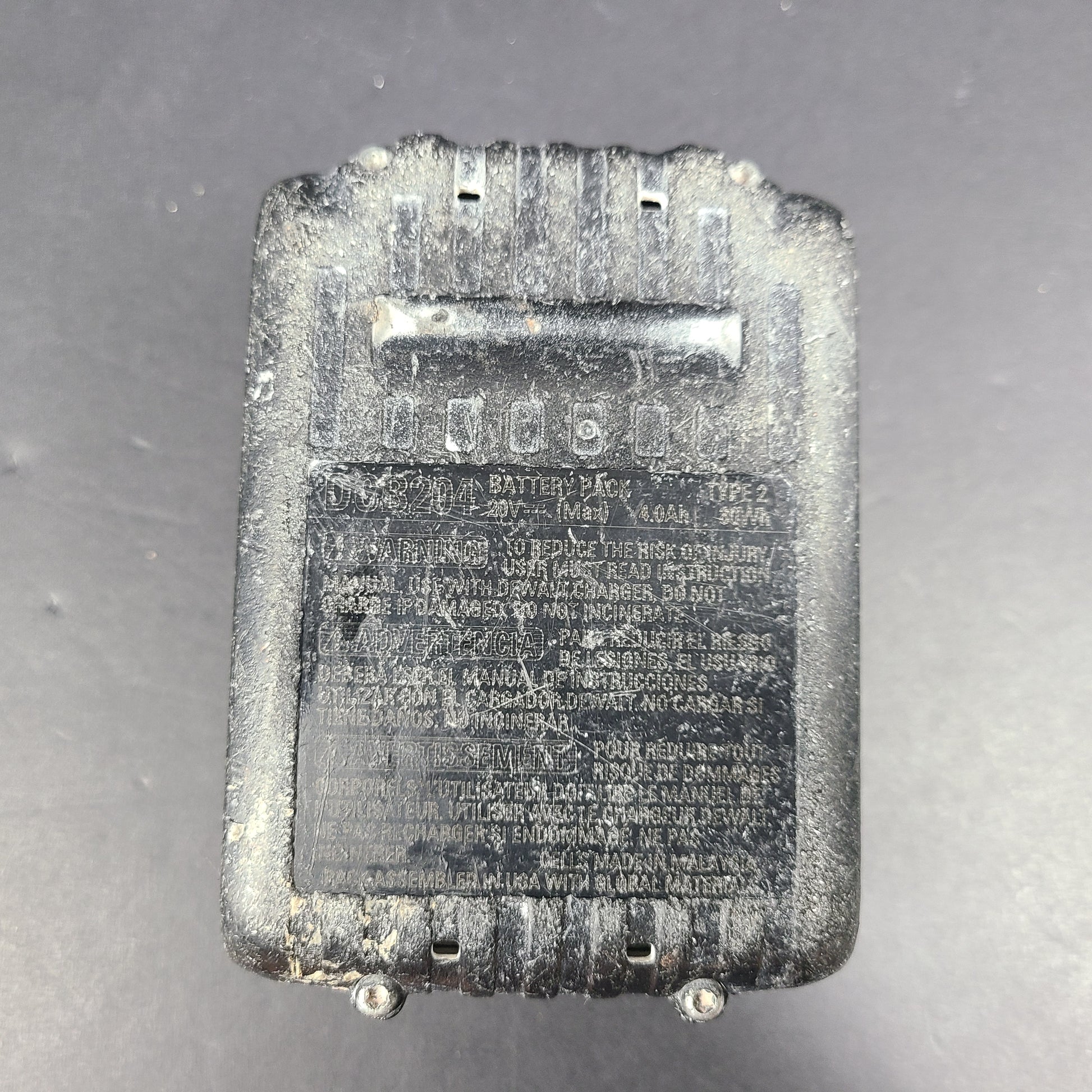 A pre-owned DeWalt XR Lithium-Ion Battery 20V Max 4Ah N089668 with noticeable wear.
