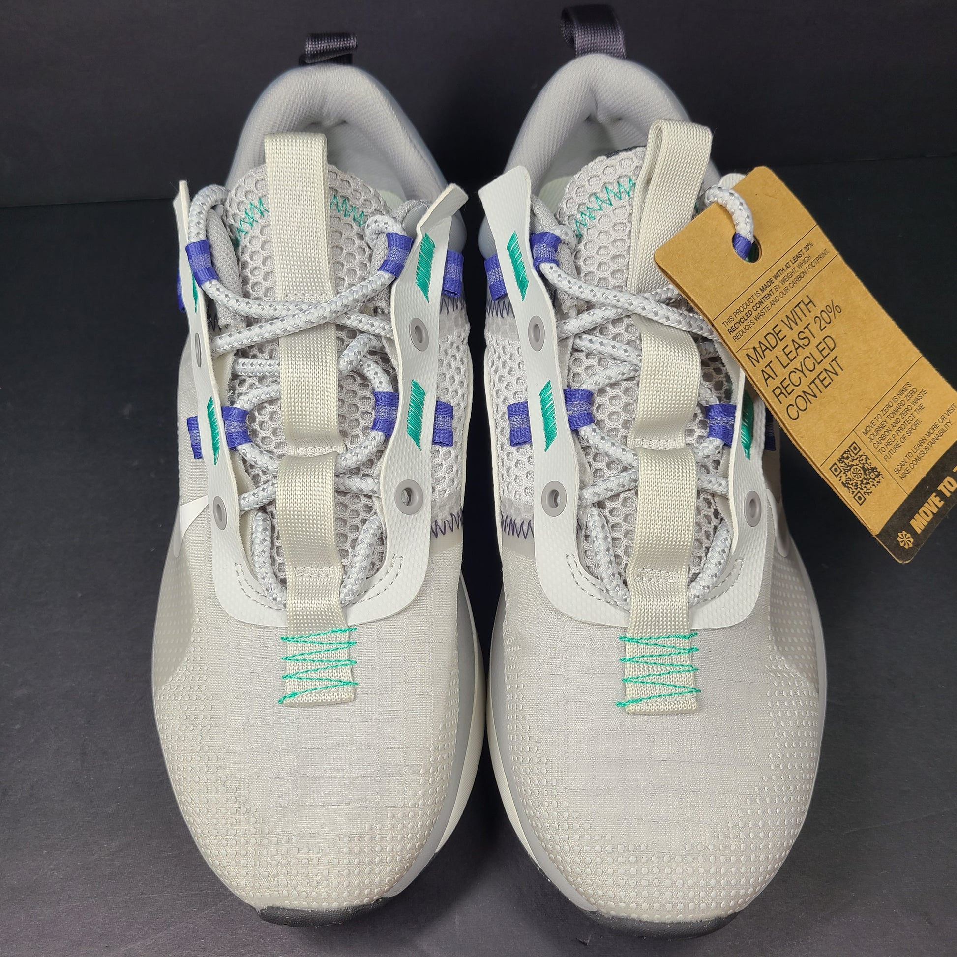 A stylish pair of men's Nike Air Max 2021 sneakers in white, green, and blue.