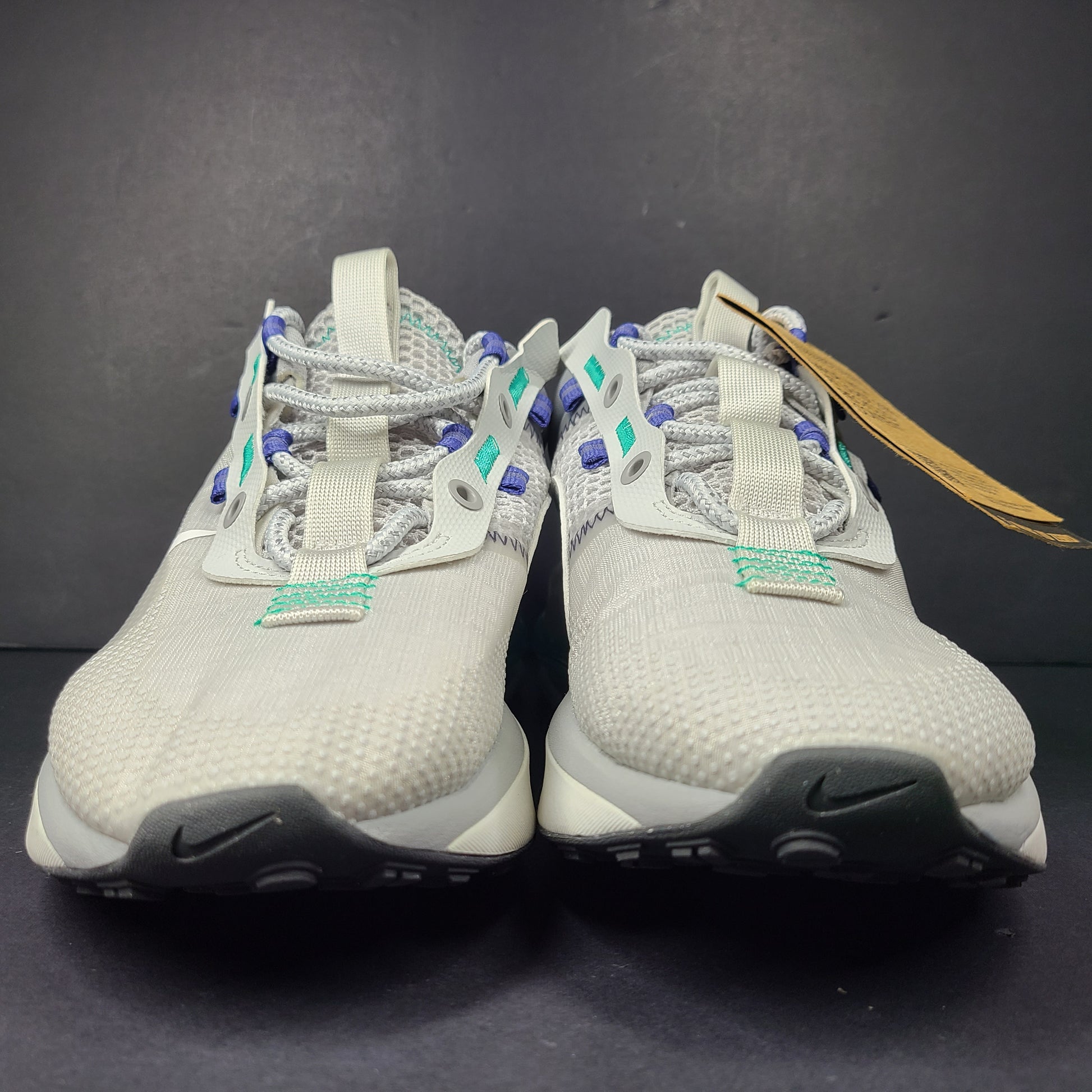 A stylish pair of men's Nike Air Max 2021 sneakers in white, green, and blue.