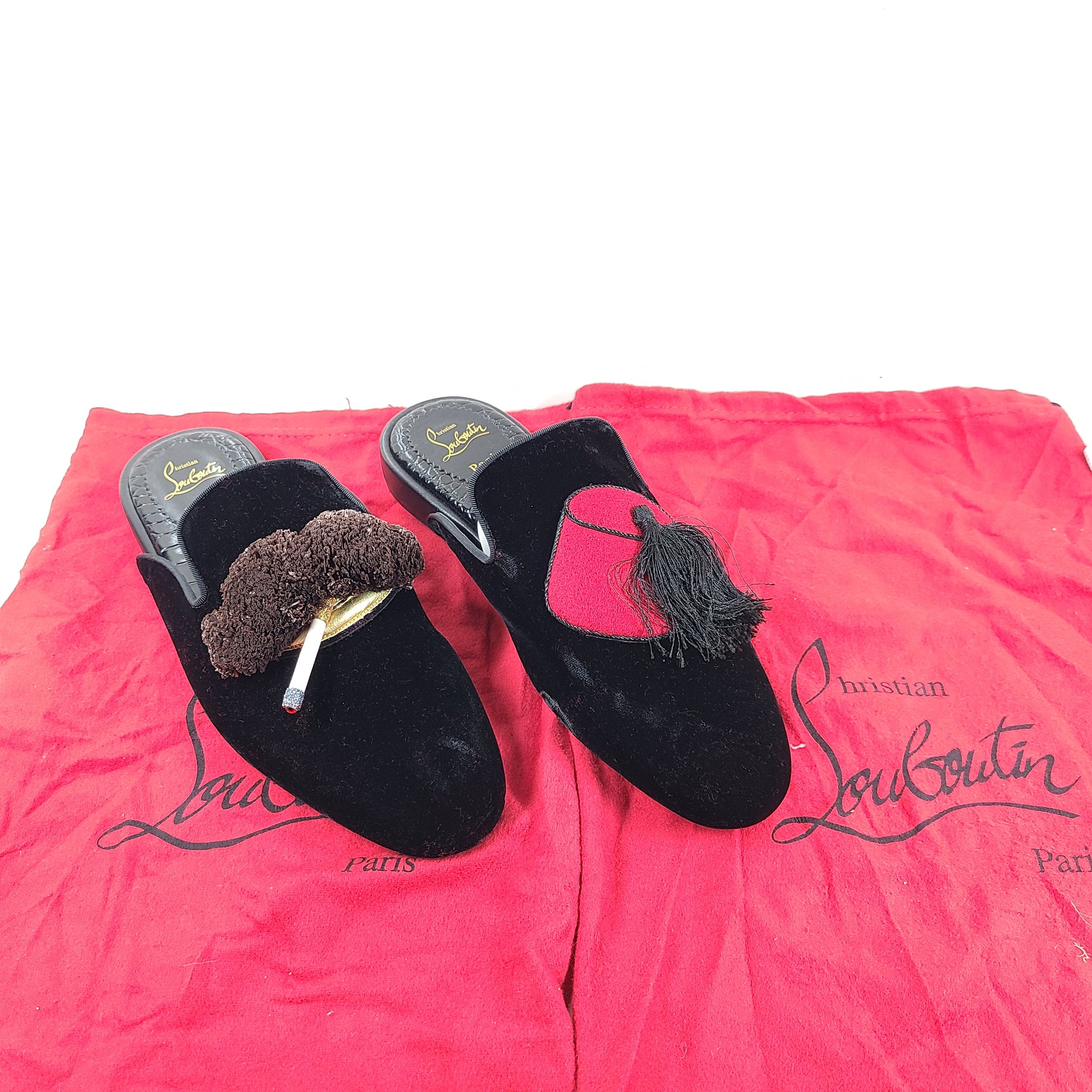 A pair of Christian Louboutin Black Velvet Tassel Slippers Size 41 for men