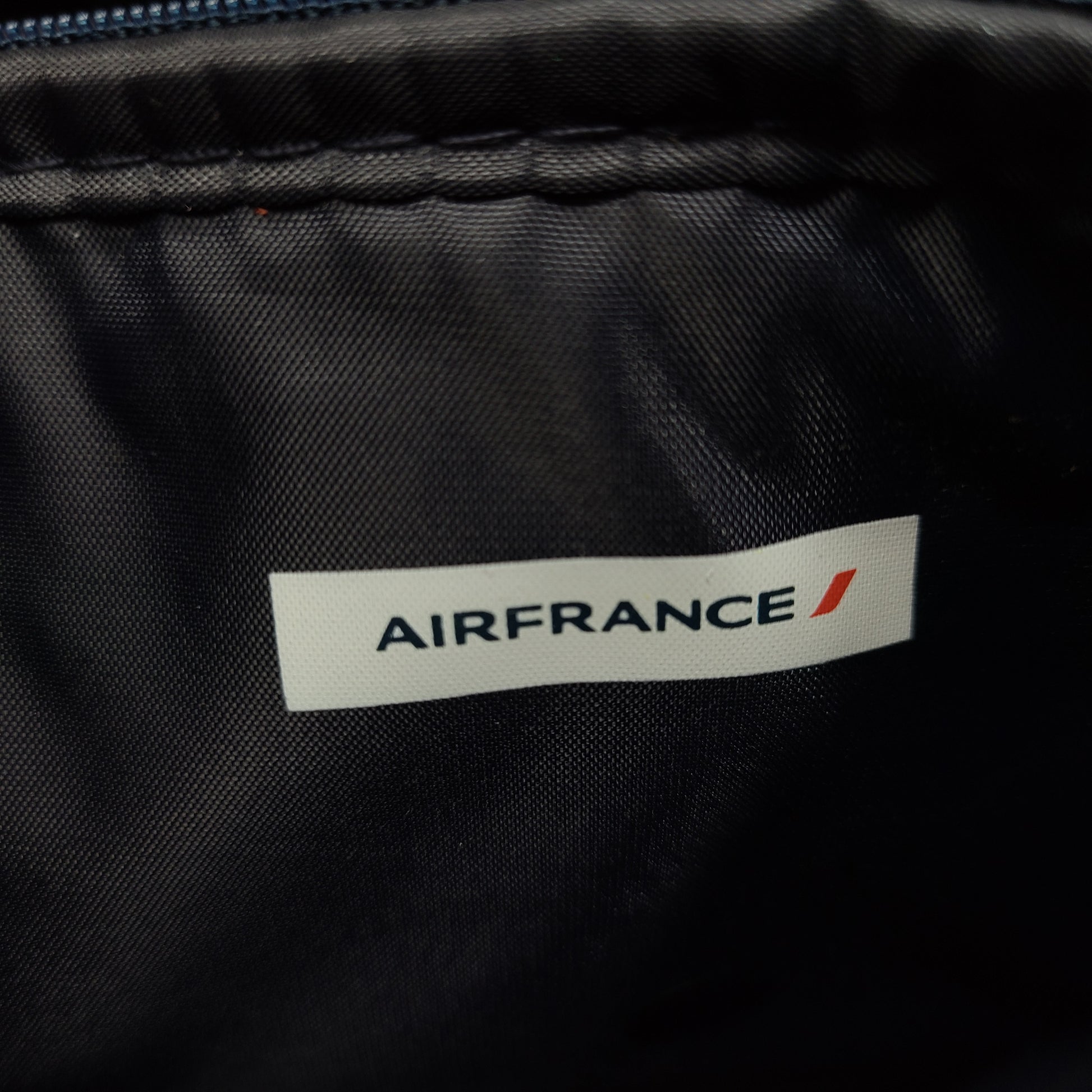 A luxurious Air France Travel Amenity Kit with Clarins skincare products