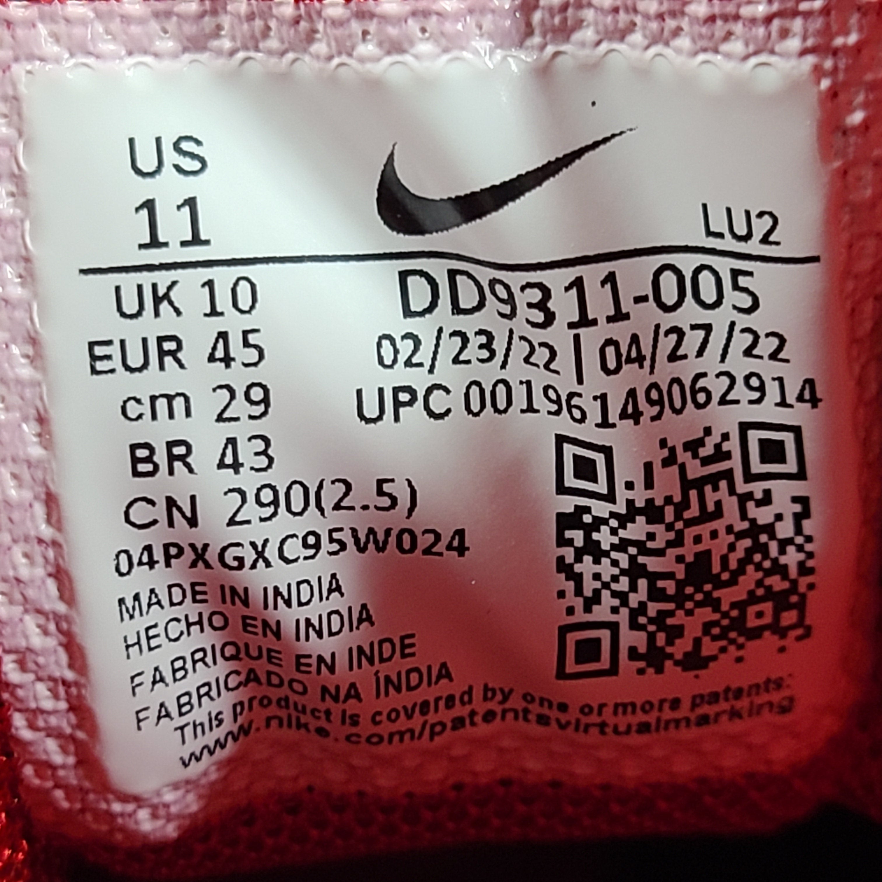 A pair of Nike men’s athletic shoes in black, red, and white.