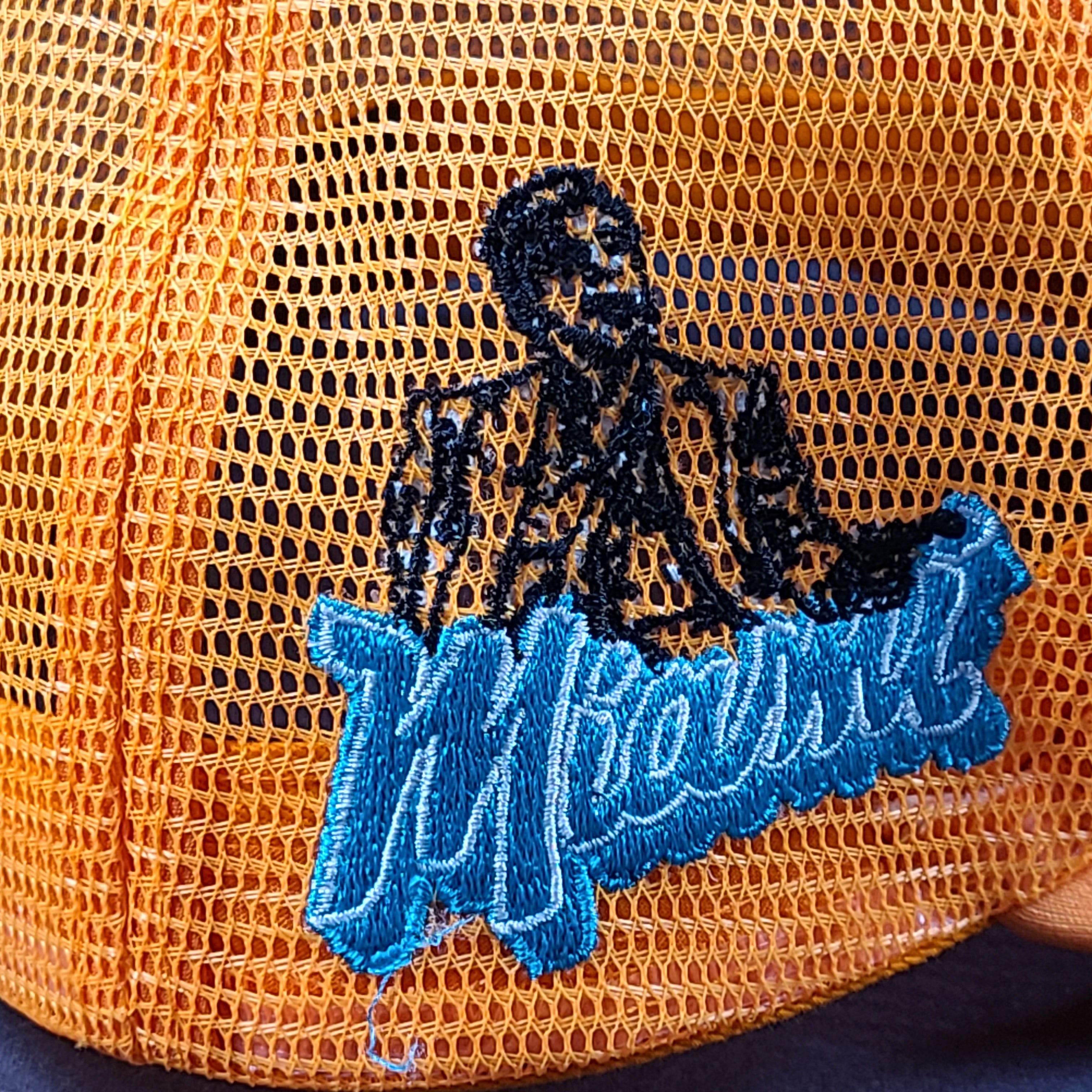 Scarface x Shoe Palace Miami orange trucker hat with mesh design and snapback closure