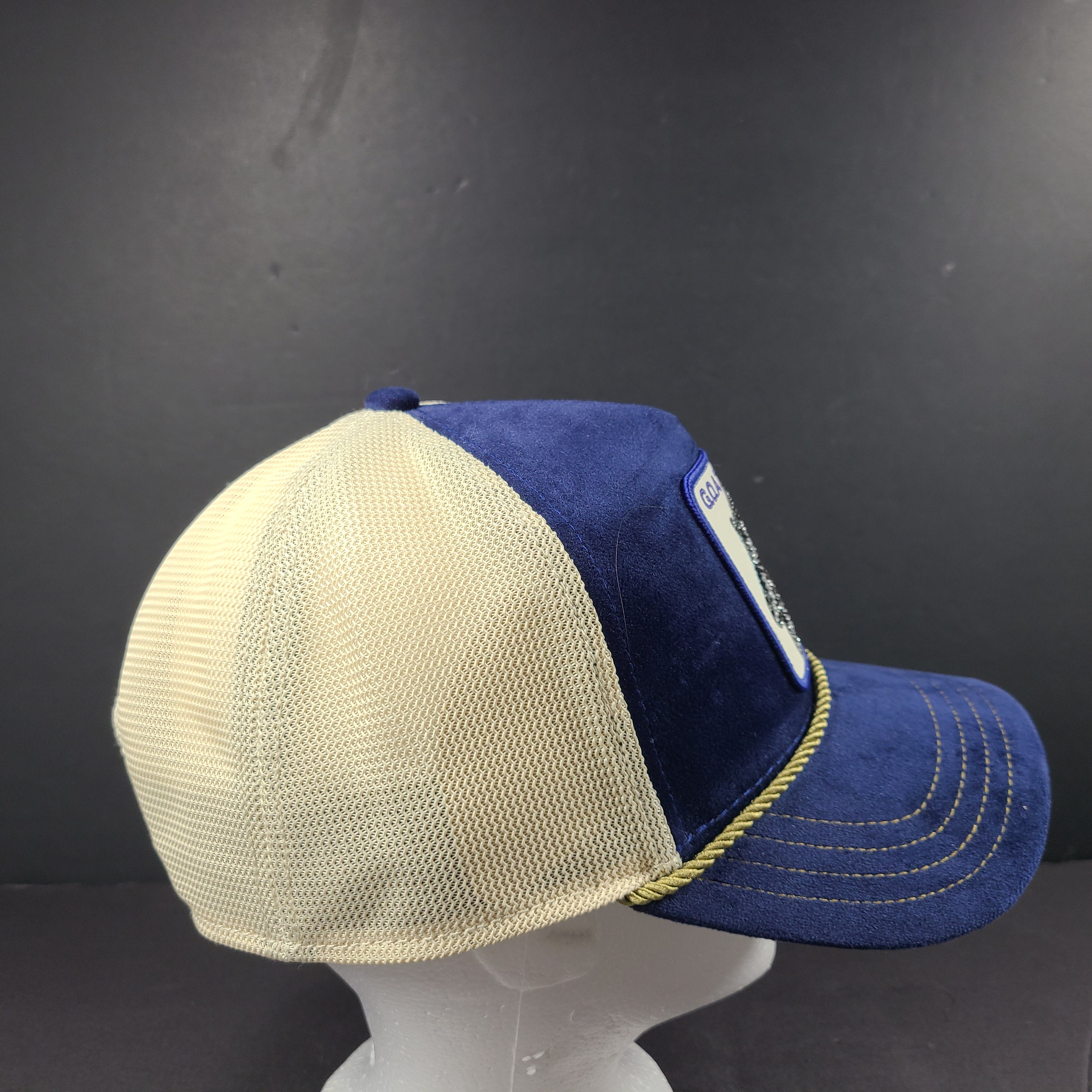 A stylish blue and beige trucker hat by Goorin Bros.