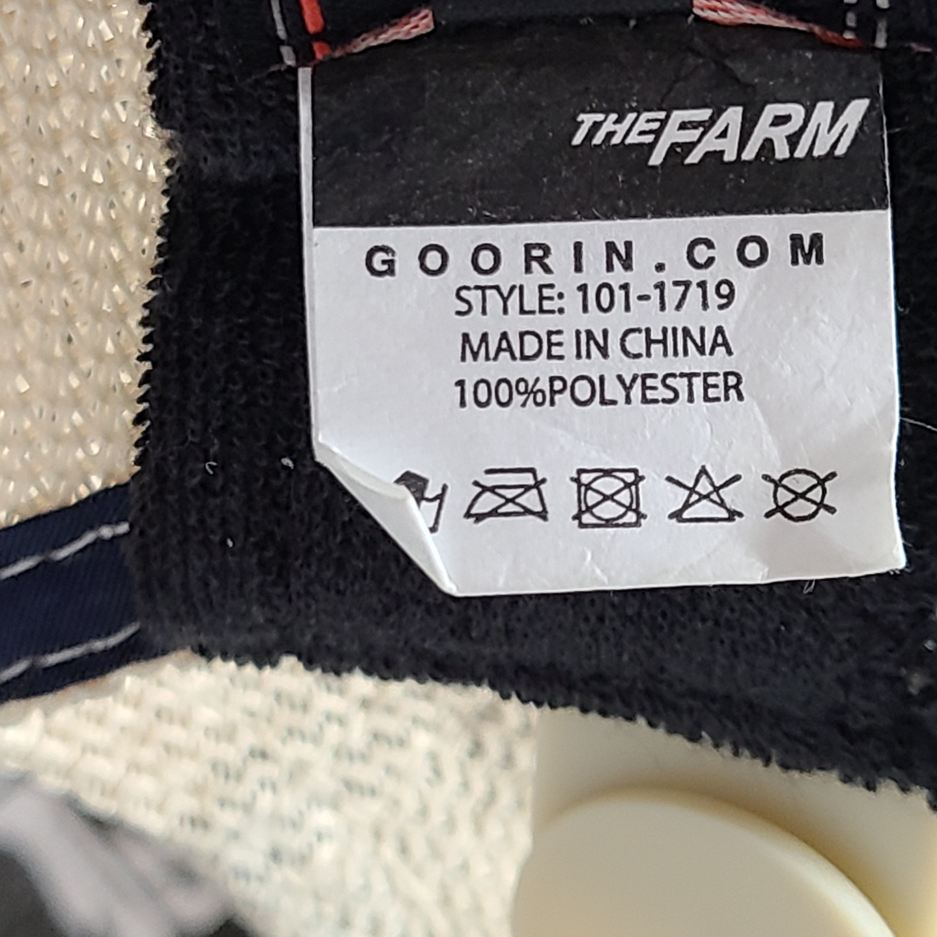 A stylish blue and beige trucker hat by Goorin Bros.