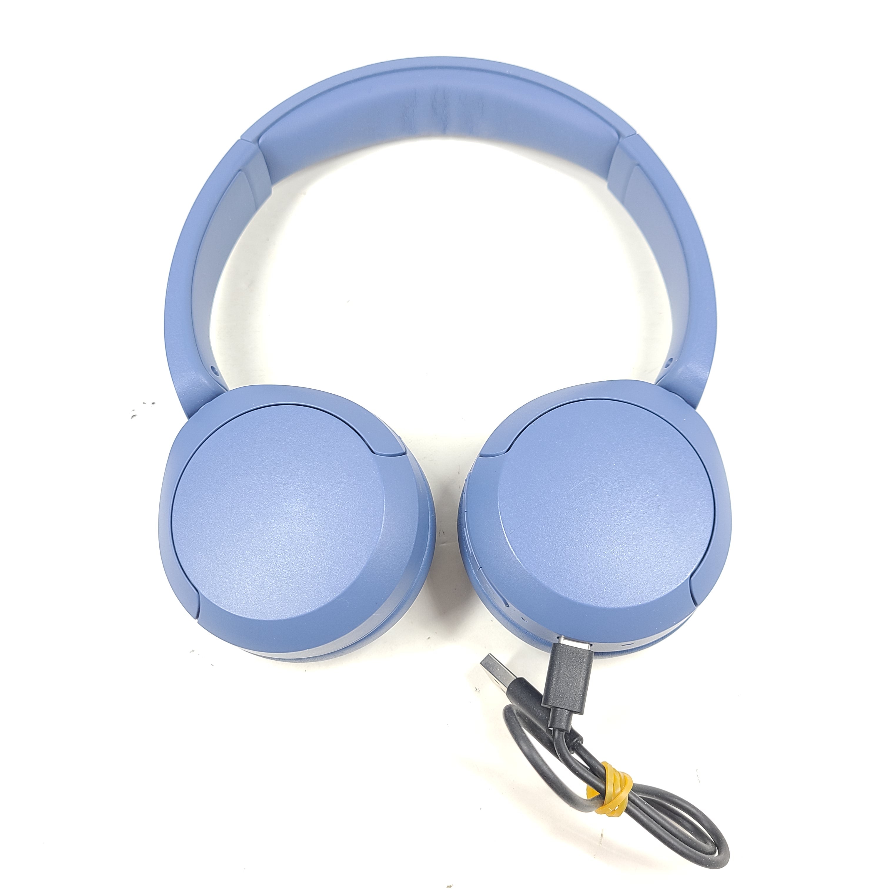 Blue Sony WH-CH520 on-ear headphones with a lightweight headband and Bluetooth connectivity for hands-free listening.